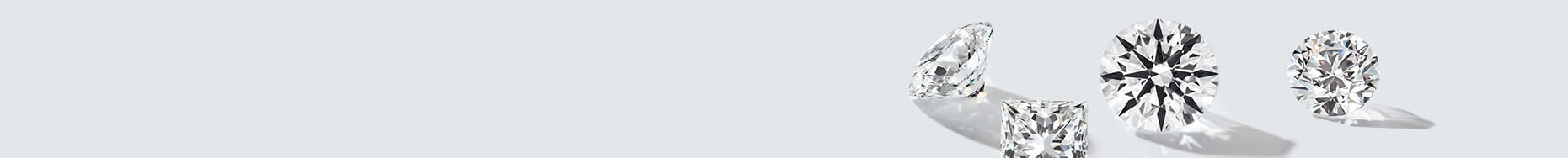 A gray background with loose True Hearts diamonds scattered throughout.