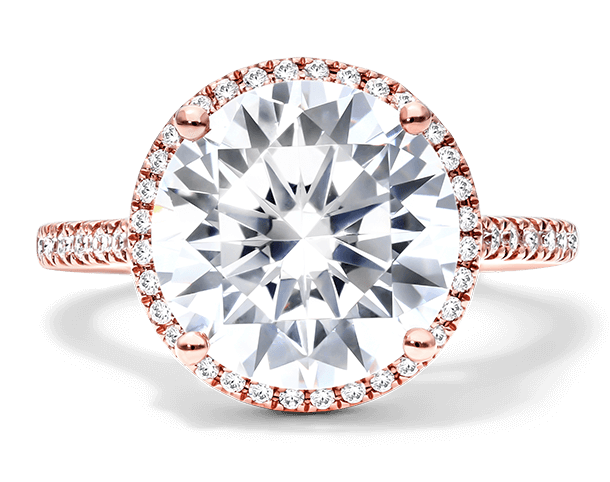 A halo engagement ring in rose gold.