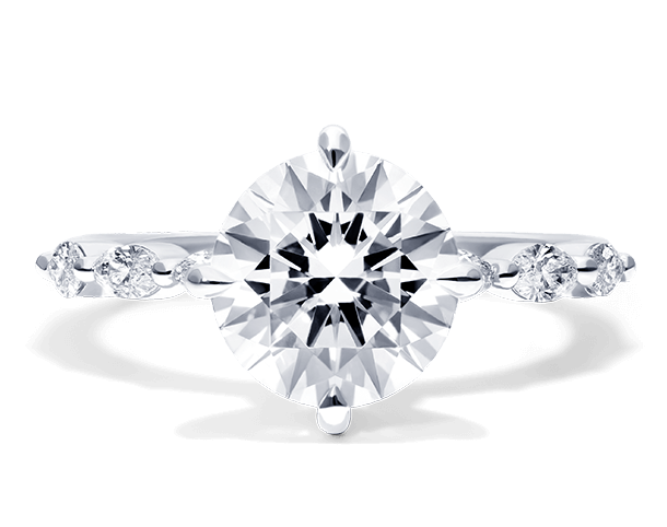 A side-stone engagement ring in white gold.