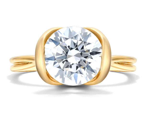 A tension engagement ring in yellow gold.