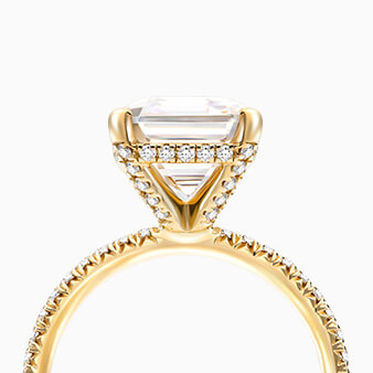 A yellow gold engagement ring.