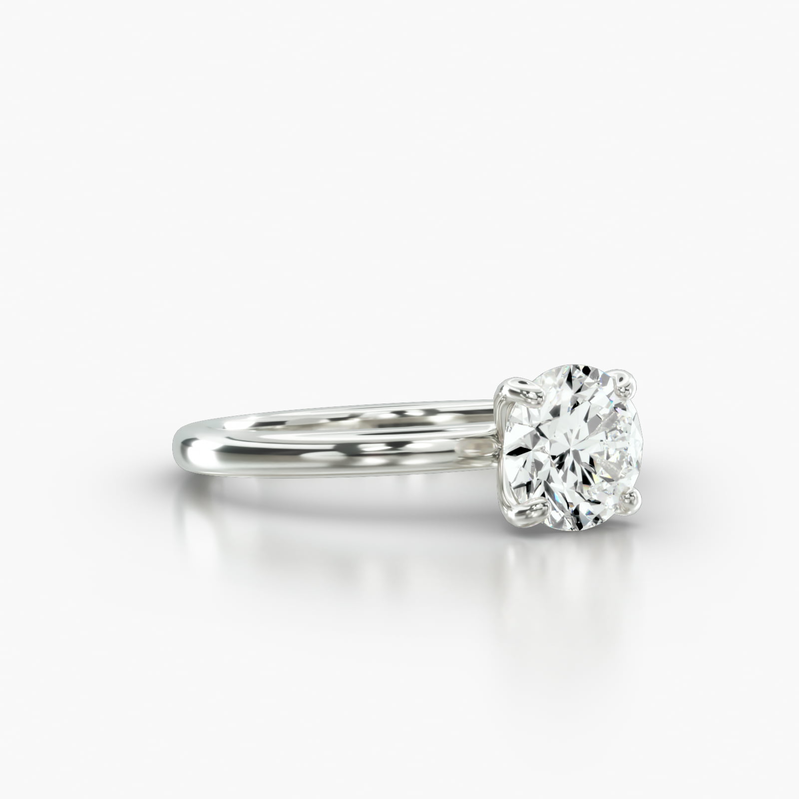 Solitaire Engagement Ring Embellished With a Four Prong Signature Head
