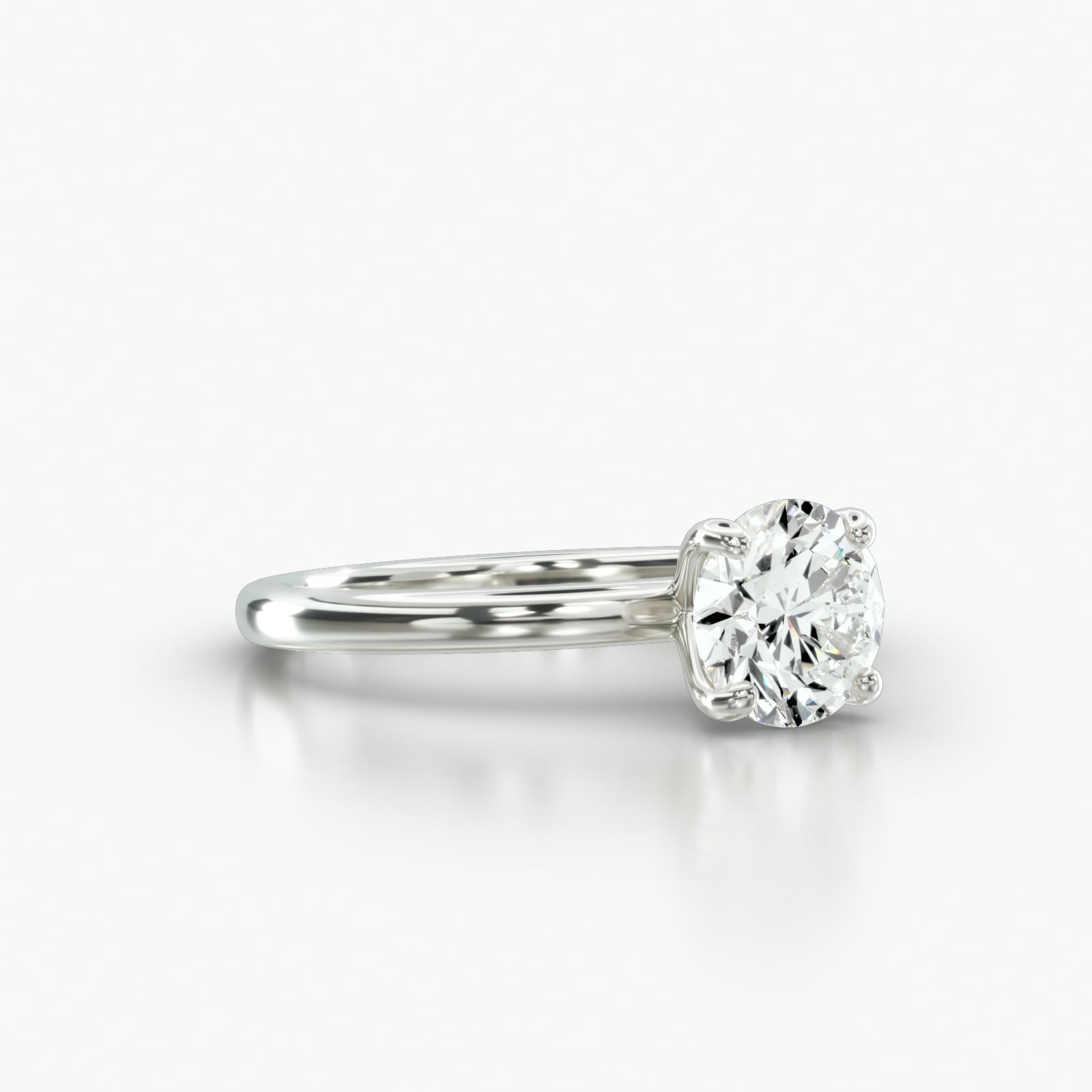 Solitaire Engagement Ring Embellished With a Four Prong Signature Head With Diamond Bridge Accent