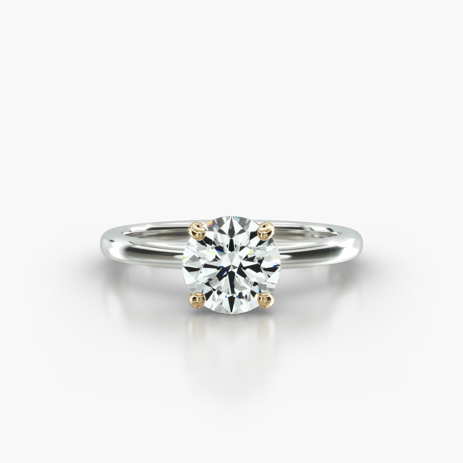 Solitaire Engagement Ring Embellished With a Four Prong Signature Head With Diamond Bridge Accent