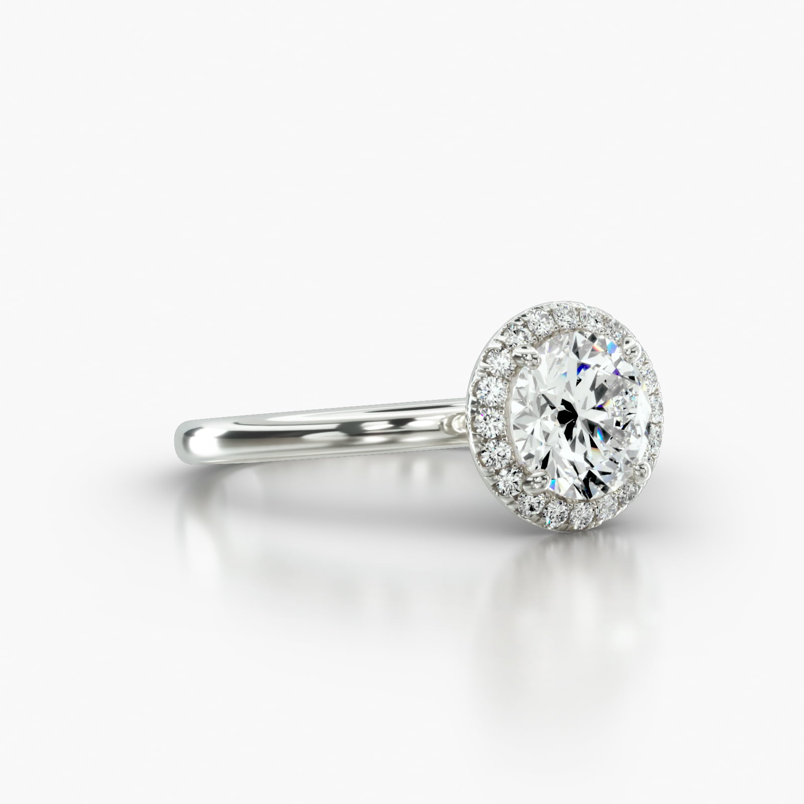 Solitaire Engagement Ring Embellished With a Single Row Pavé Halo Head