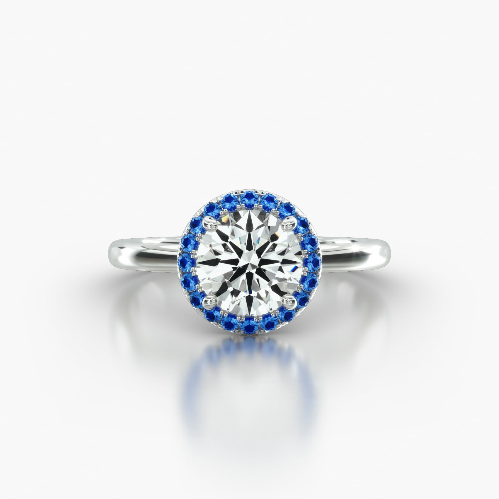 Solitaire Engagement Ring Embellished With a Single Row Sapphire Pavé Halo Head