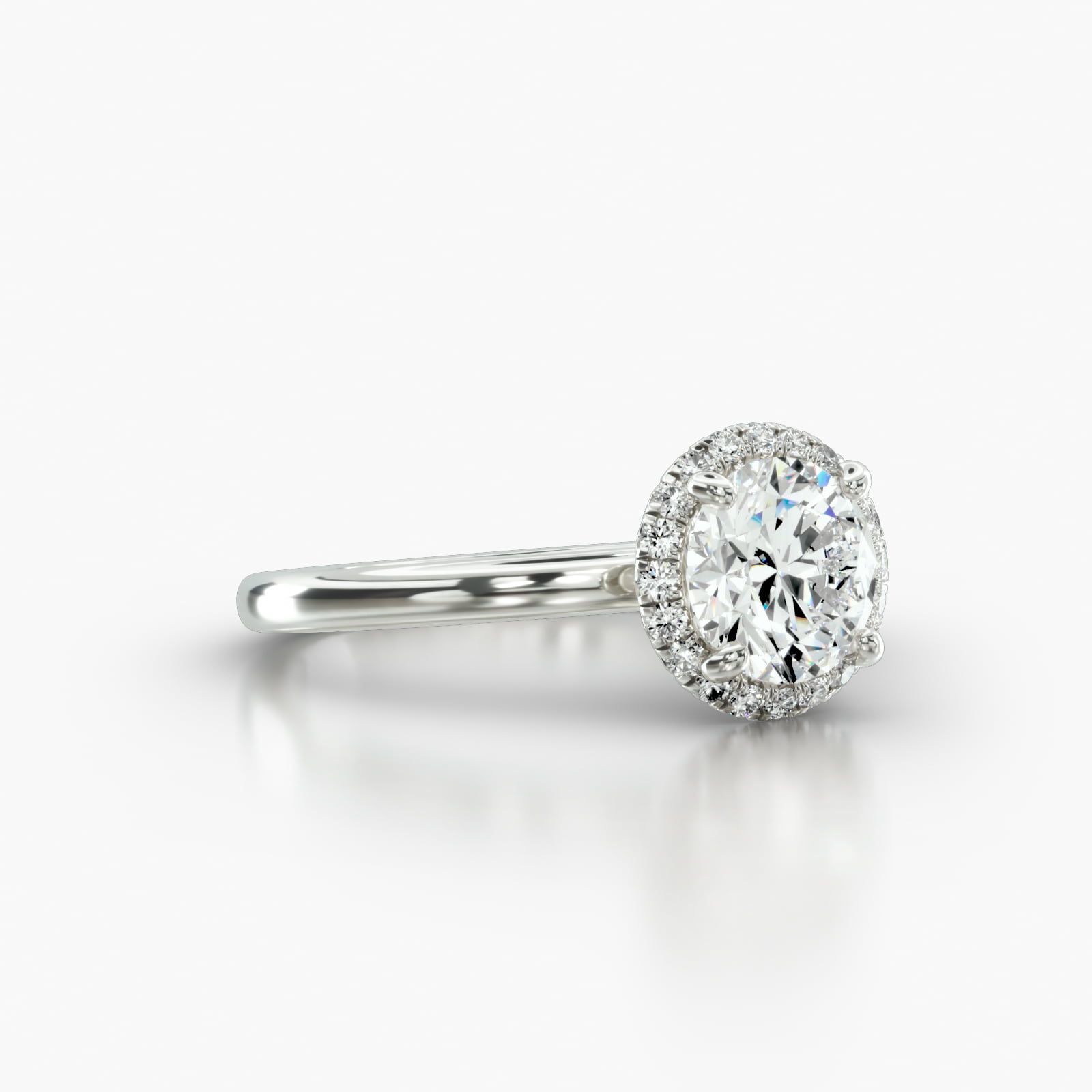 Solitaire Engagement Ring Embellished With a French Pavé Halo Head
