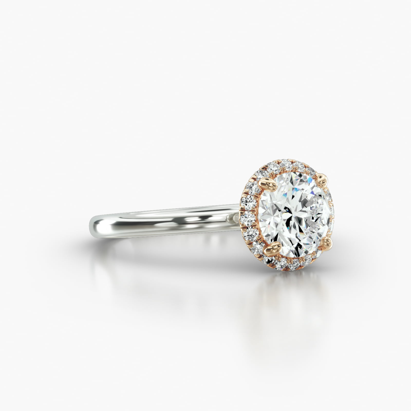 Solitaire Engagement Ring Embellished With a French Pavé Halo Head