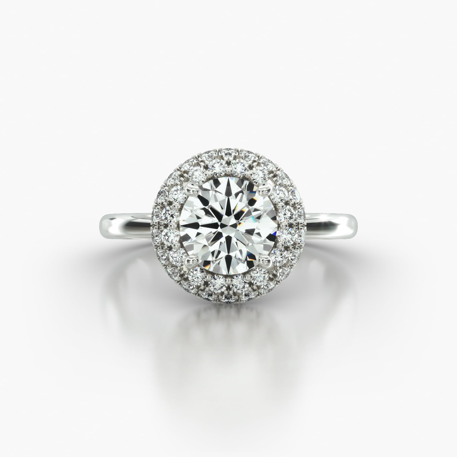 Solitaire Engagement Ring Embellished With a Falling Edge Pavé Halo Head