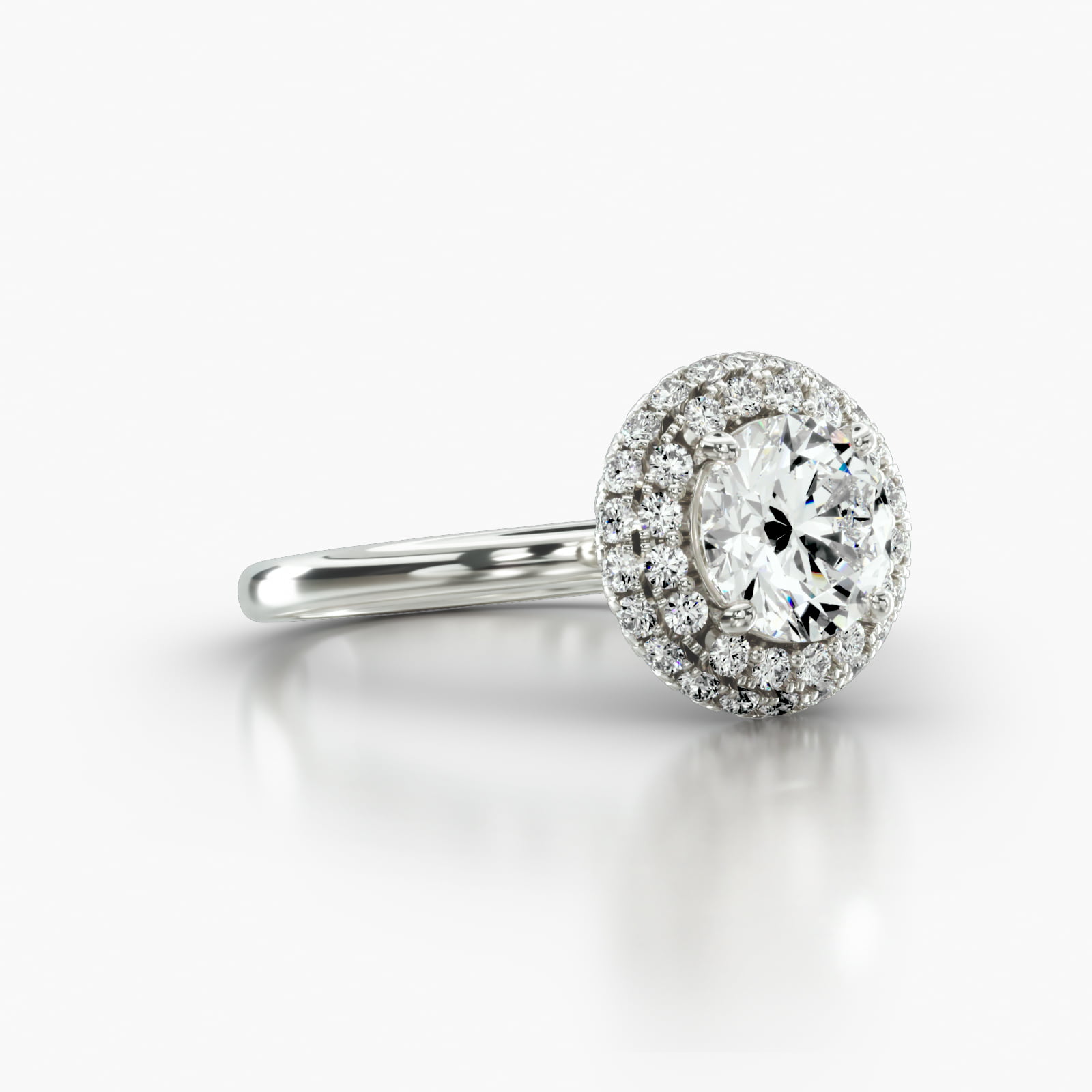 Solitaire Engagement Ring Embellished With a Falling Edge Pavé Halo Head