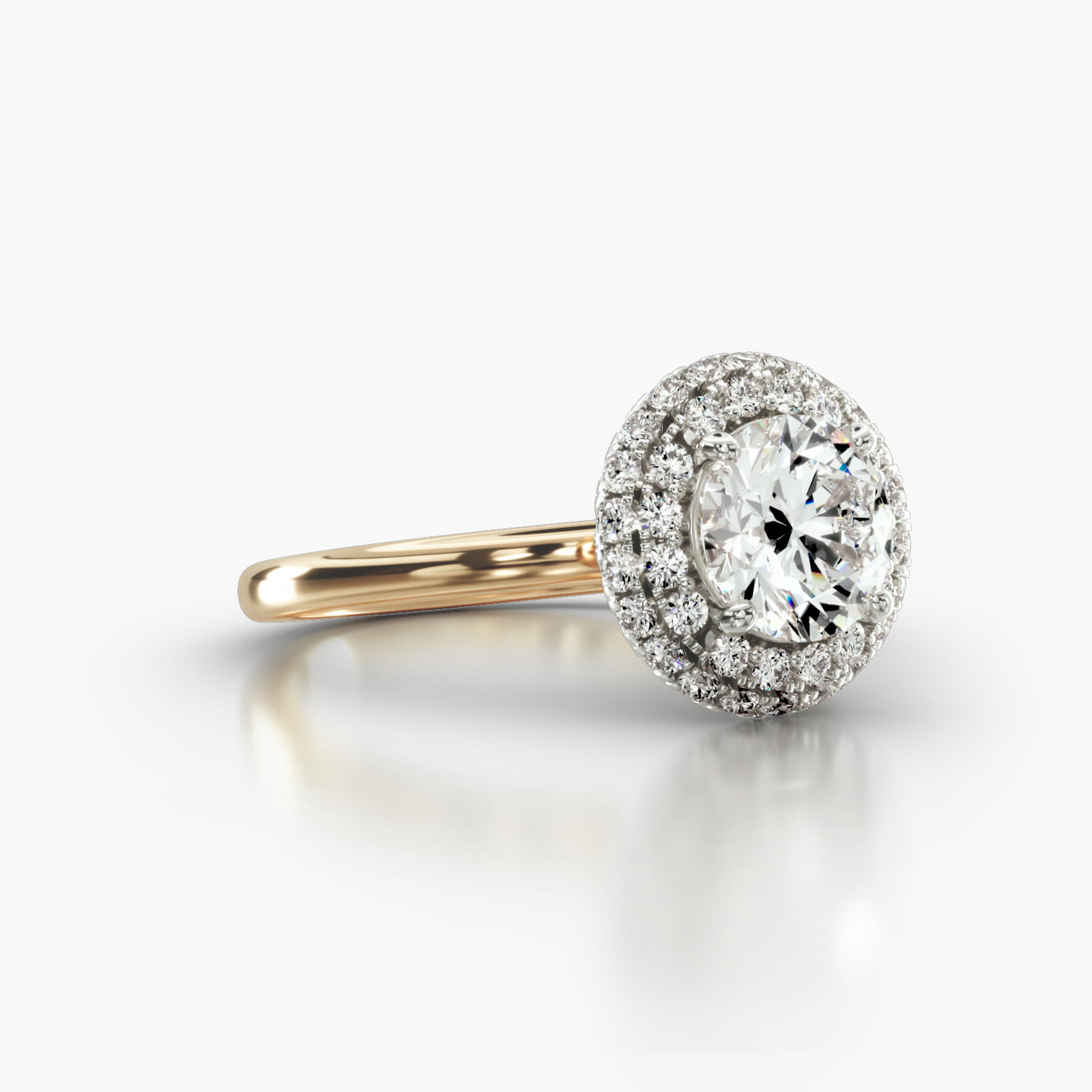 Solitaire Engagement Ring Embellished With a Falling Edge Pavé Halo Head