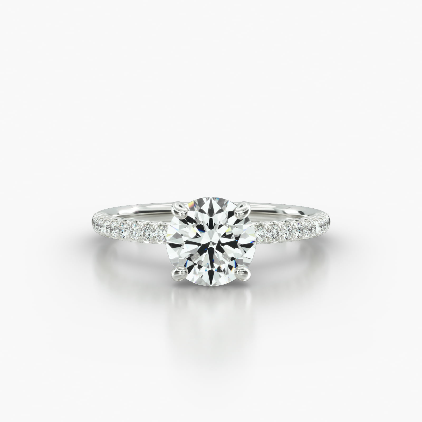 Petite French Pavé Engagement Ring Embellished With a Four Prong Signature Head