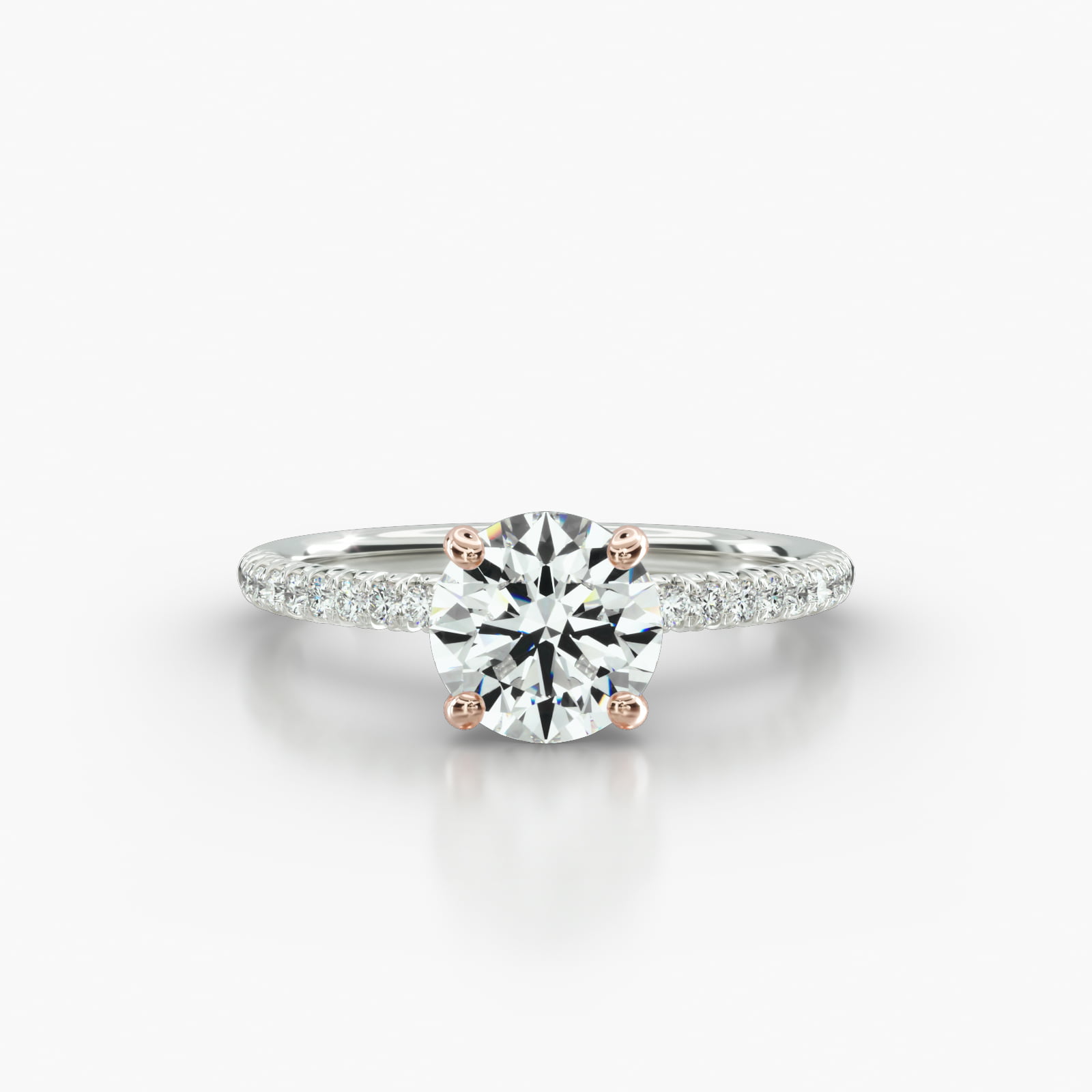 Petite French Pavé Engagement Ring Embellished With a Four Prong Signature Head With Diamond Bridge Accent