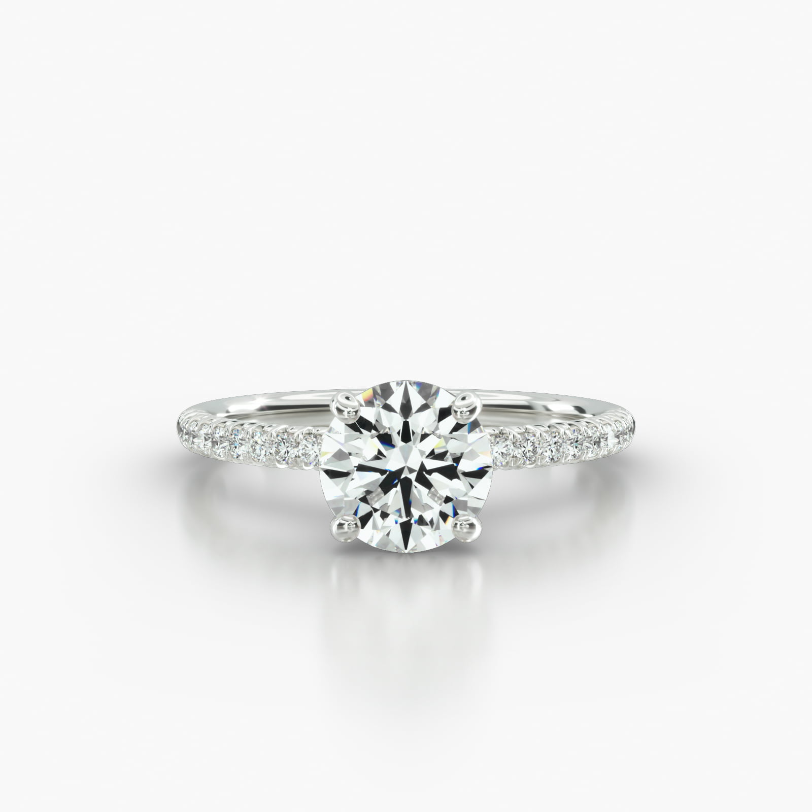 Petite French Pavé Engagement Ring Embellished With a Four Prong Signature Head With Diamond Bridge Accent