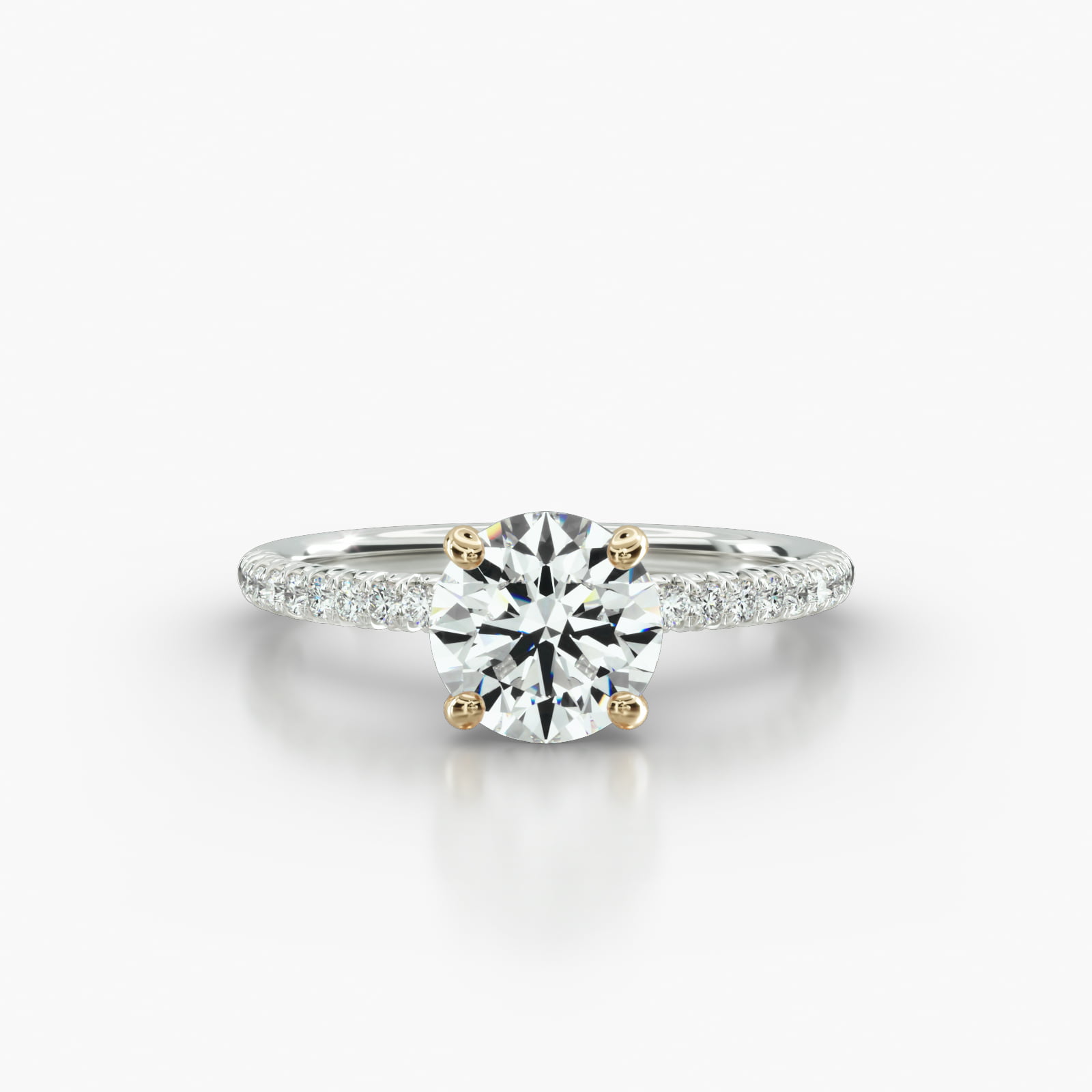 Petite French Pavé Engagement Ring Embellished With a Four Prong Signature Head With Sapphire Bridge Accent