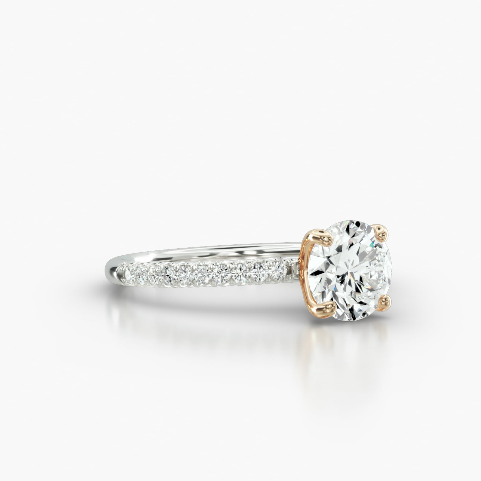 Petite French Pavé Engagement Ring Embellished With a Four Prong Signature Head With Sapphire Bridge Accent