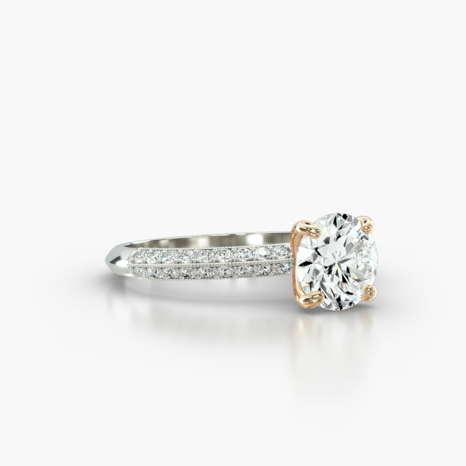 Knife Edge Pavé Engagement Ring Embellished With a Four Prong Signature Head