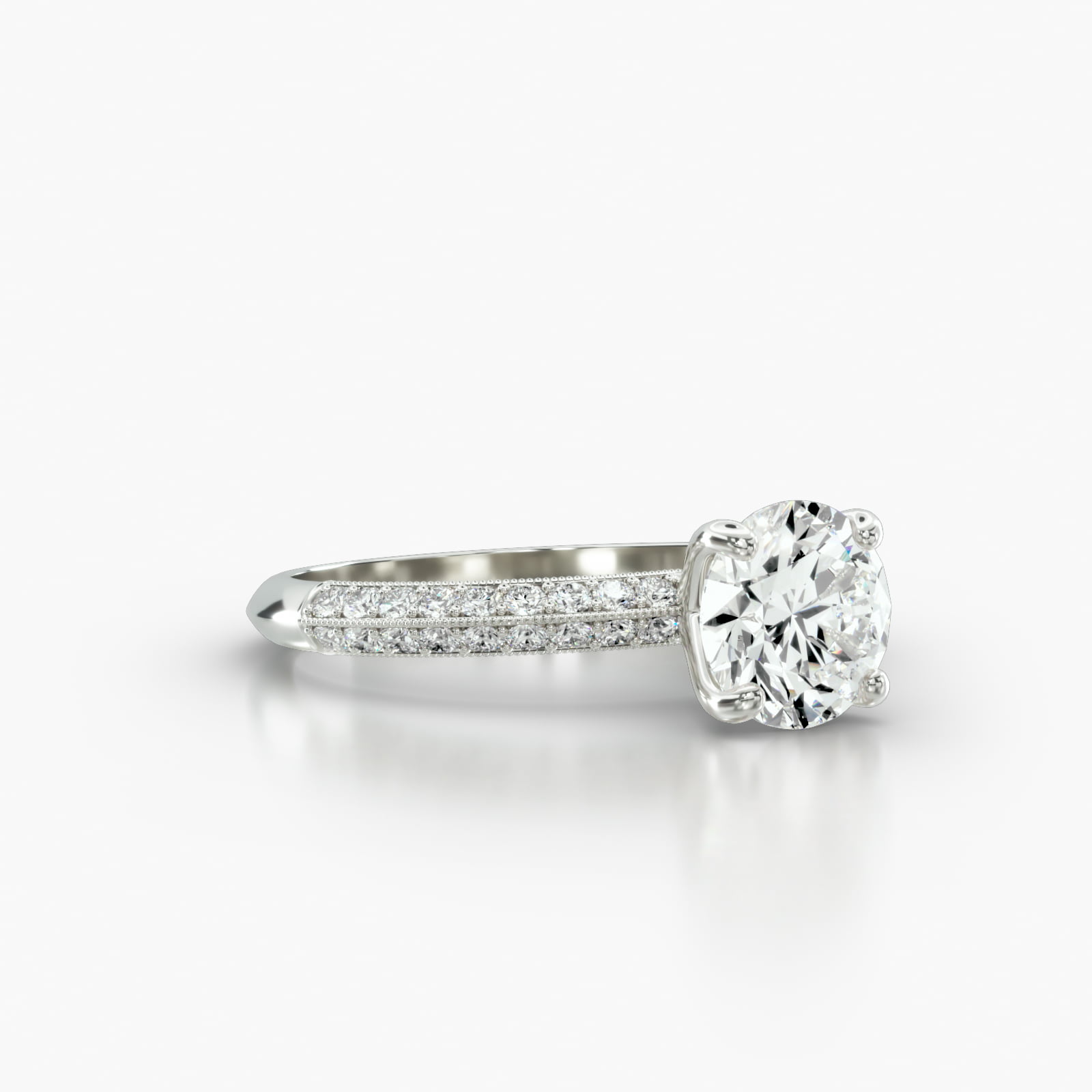 Knife Edge Pavé Engagement Ring Embellished With a Four Prong Signature Head With Diamond Bridge Accent