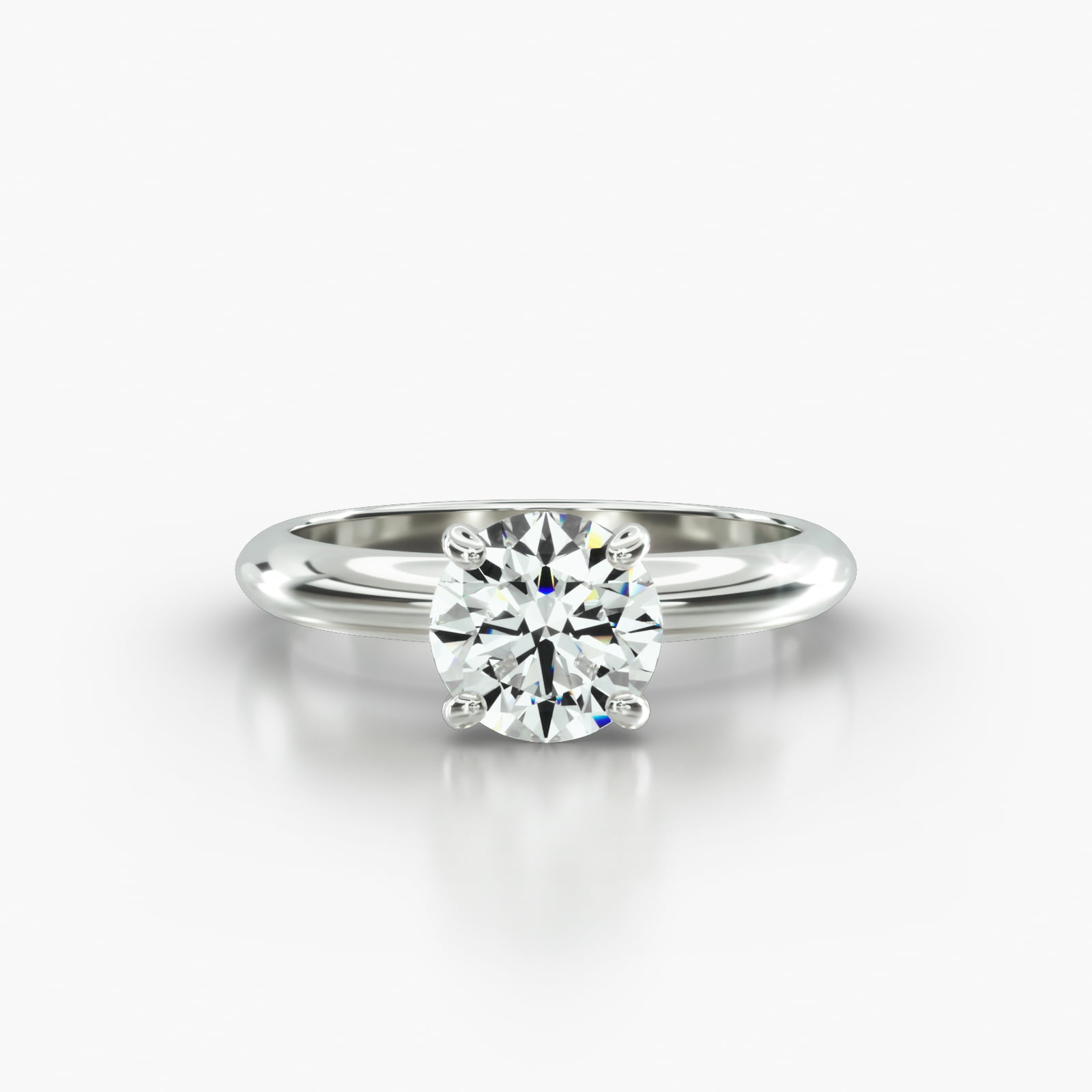 Knife Edge Solitaire Engagement Ring Embellished With a Four Prong Signature Head