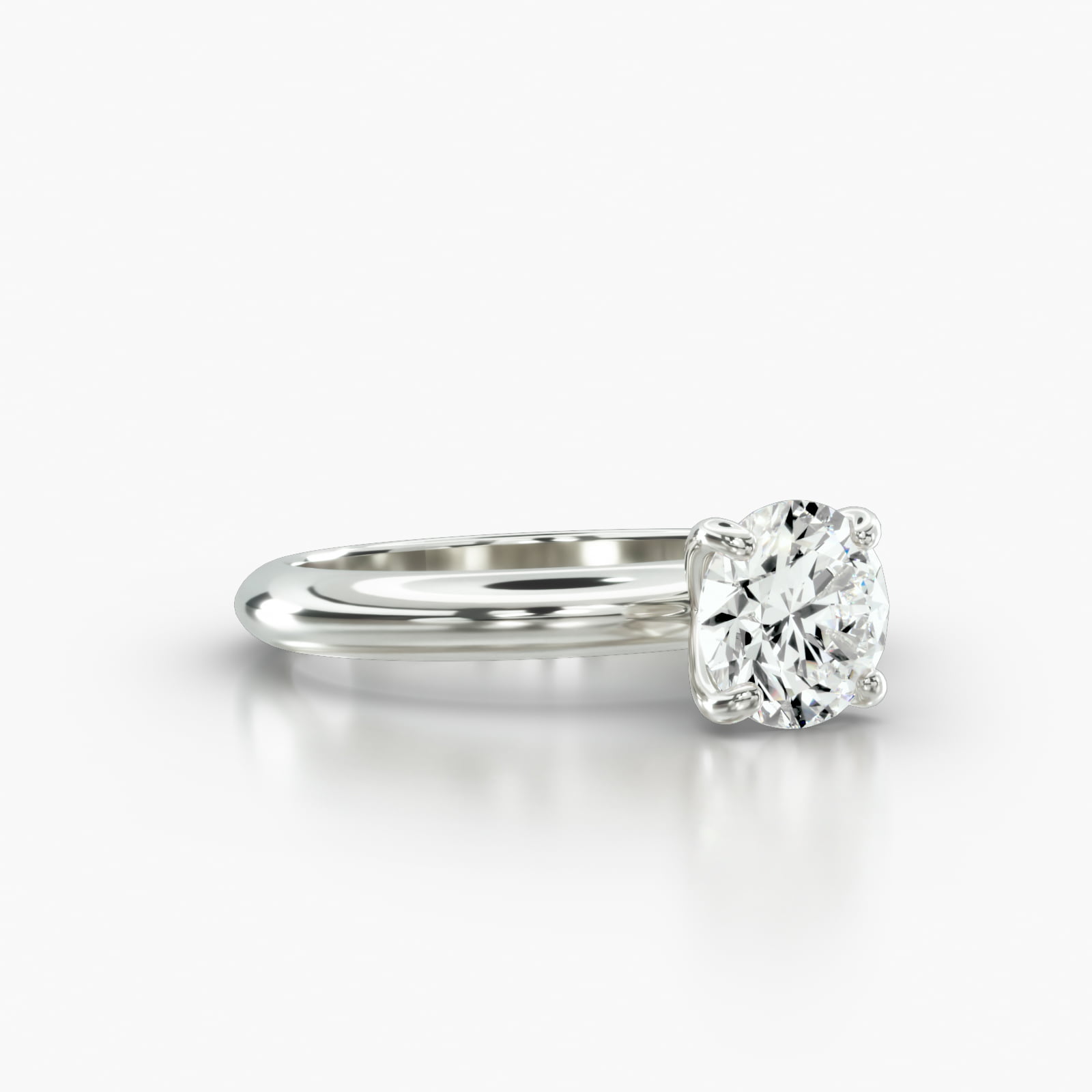 Knife Edge Solitaire Engagement Ring Embellished With a Four Prong Signature Head
