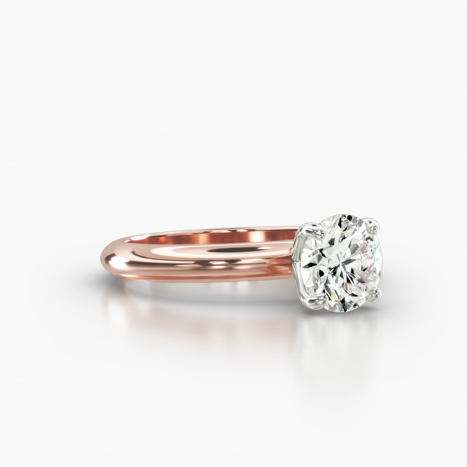 Knife Edge Solitaire Engagement Ring Embellished With a Four Prong Signature Head With Diamond Bridge Accent
