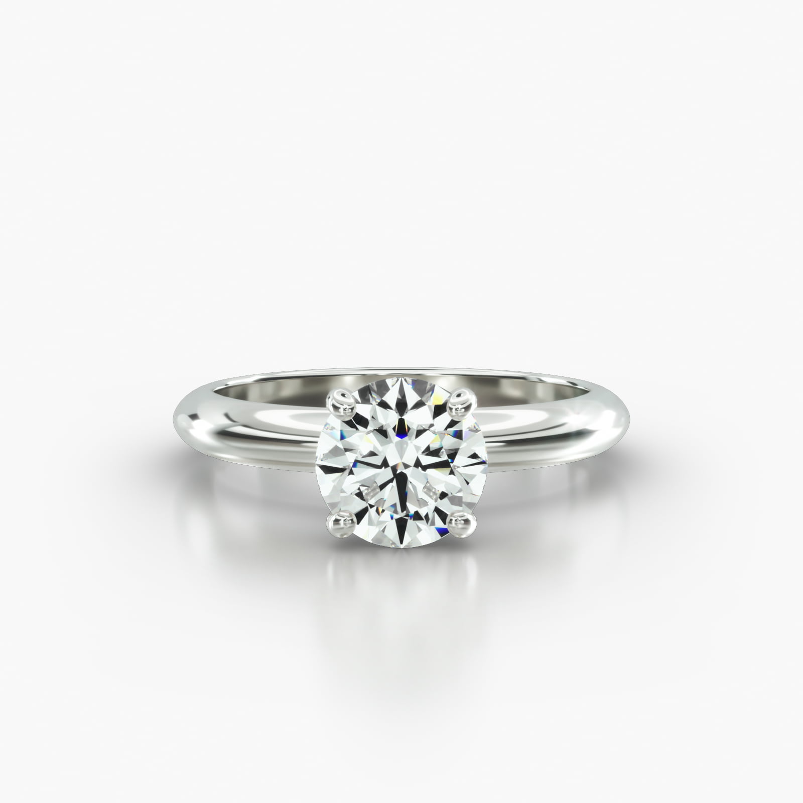 Knife Edge Solitaire Engagement Ring Embellished With a Four Prong Signature Head With Diamond Bridge Accent