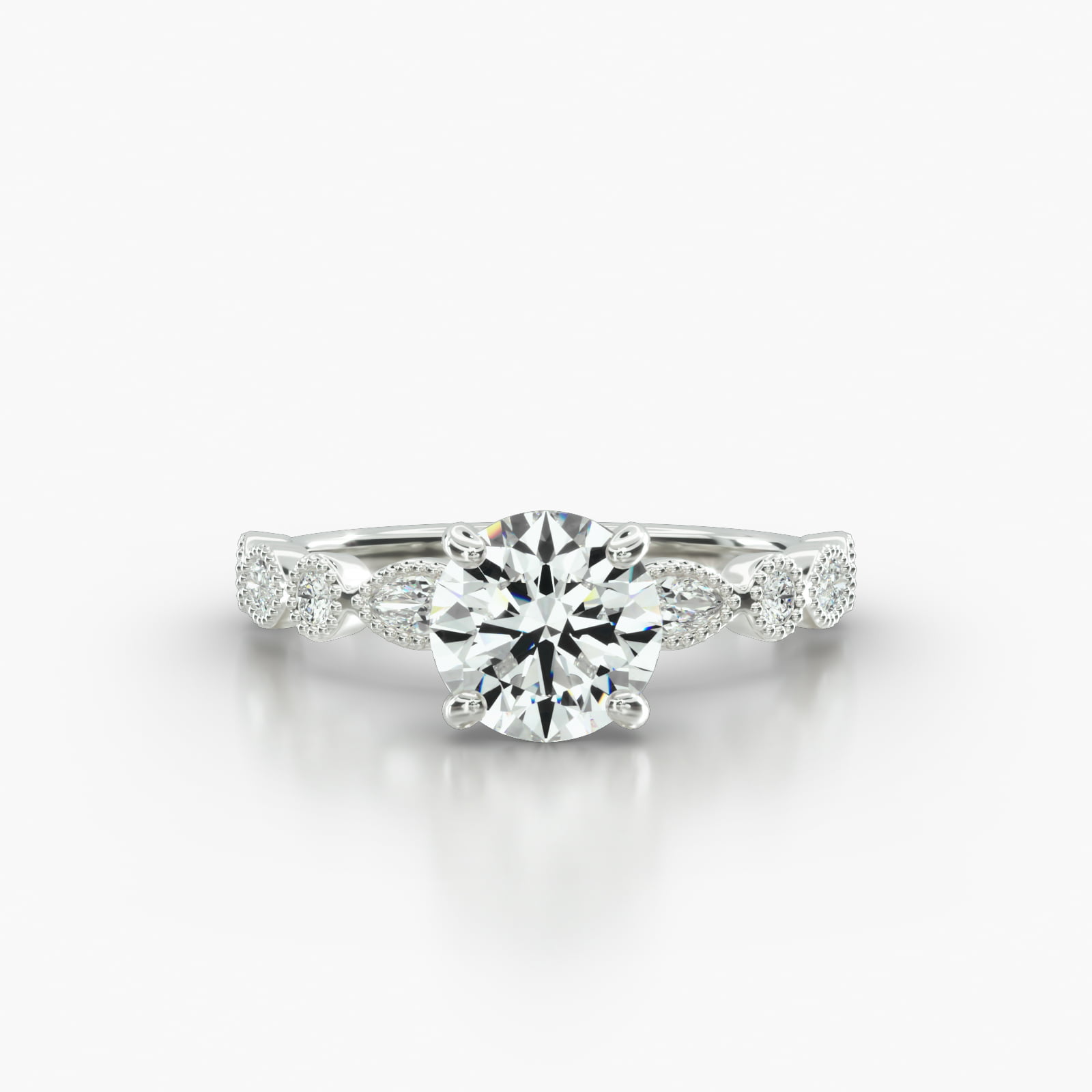 Round & Marquise Shape Diamond Engagement Ring Embellished With a Four Prong Signature Head