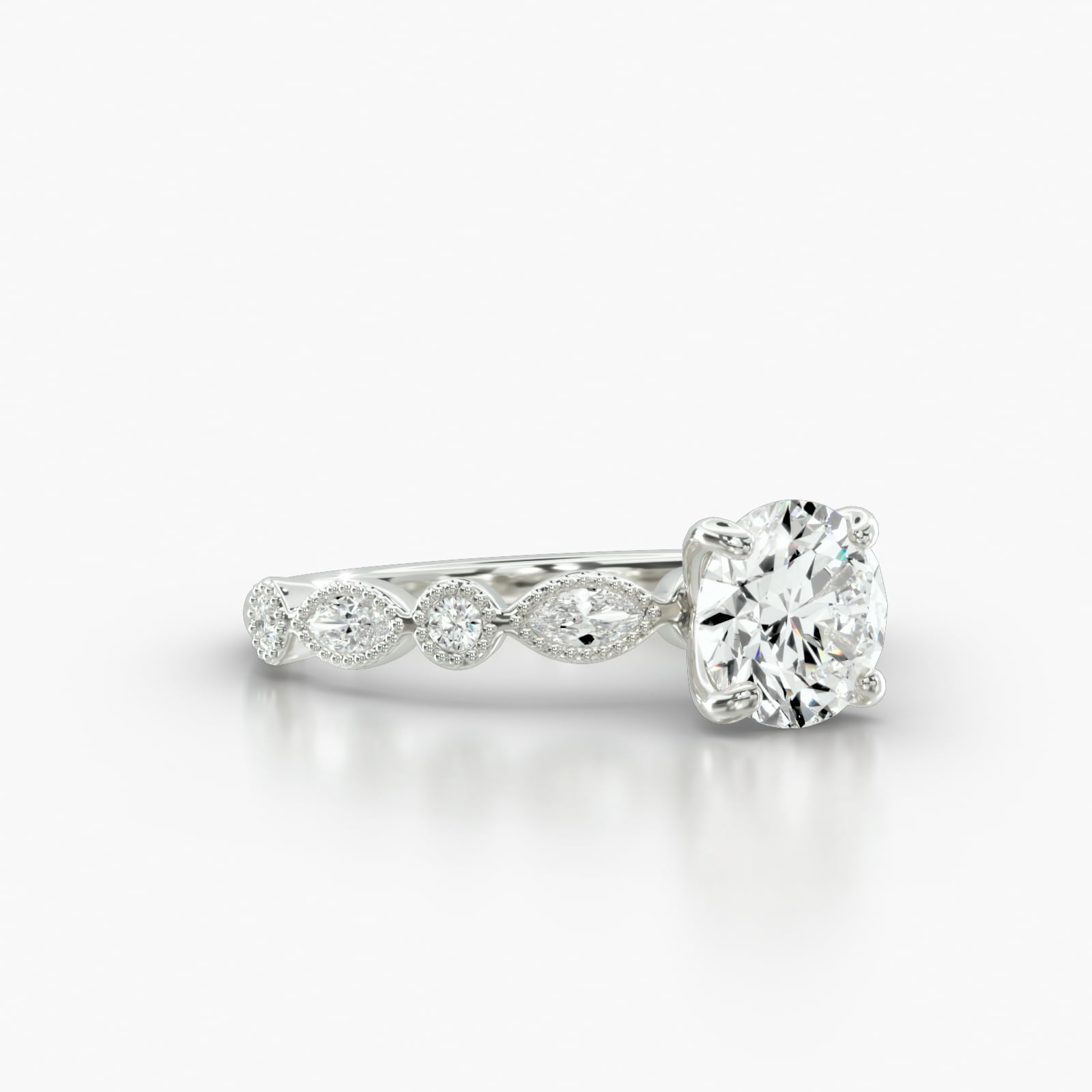 Round & Marquise Shape Diamond Engagement Ring Embellished With a Four Prong Signature Head