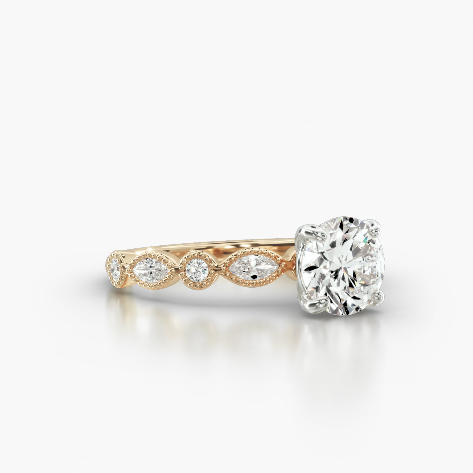 Round & Marquise Shape Diamond Engagement Ring Embellished With a Classic Basket Head
