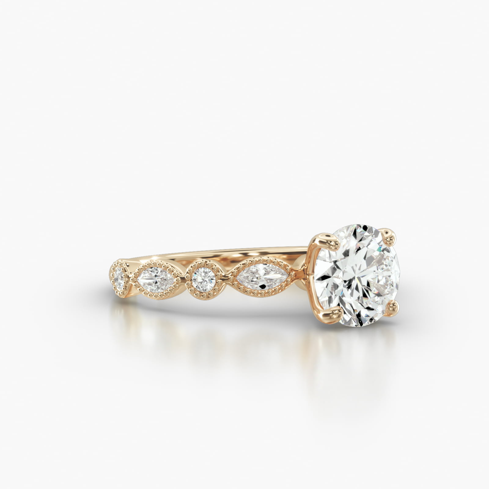 Round & Marquise Shape Diamond Engagement Ring Embellished With a Four Prong Signature Head With Diamond Bridge Accent