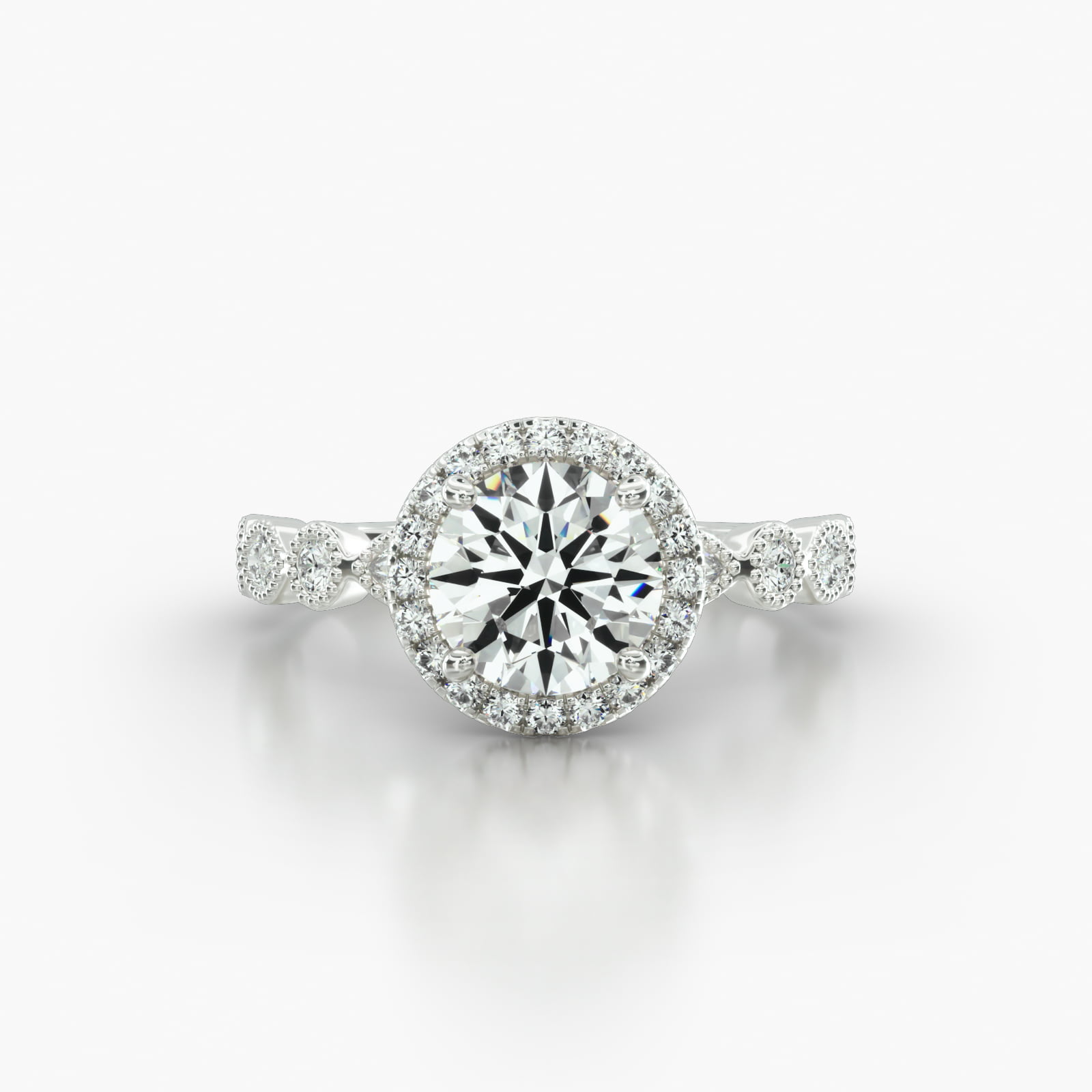 Round & Marquise Shape Diamond Engagement Ring Embellished With a Single Row Pavé Halo Head