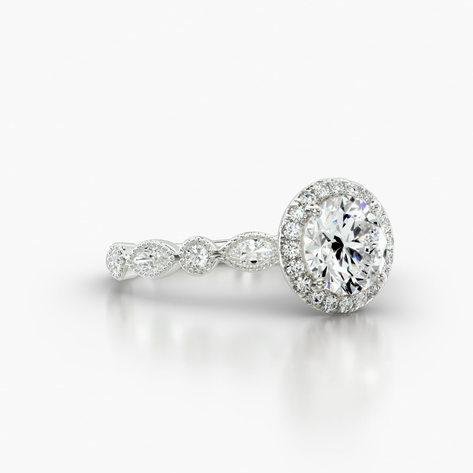 Round & Marquise Shape Diamond Engagement Ring Embellished With a Single Row Pavé Halo Head