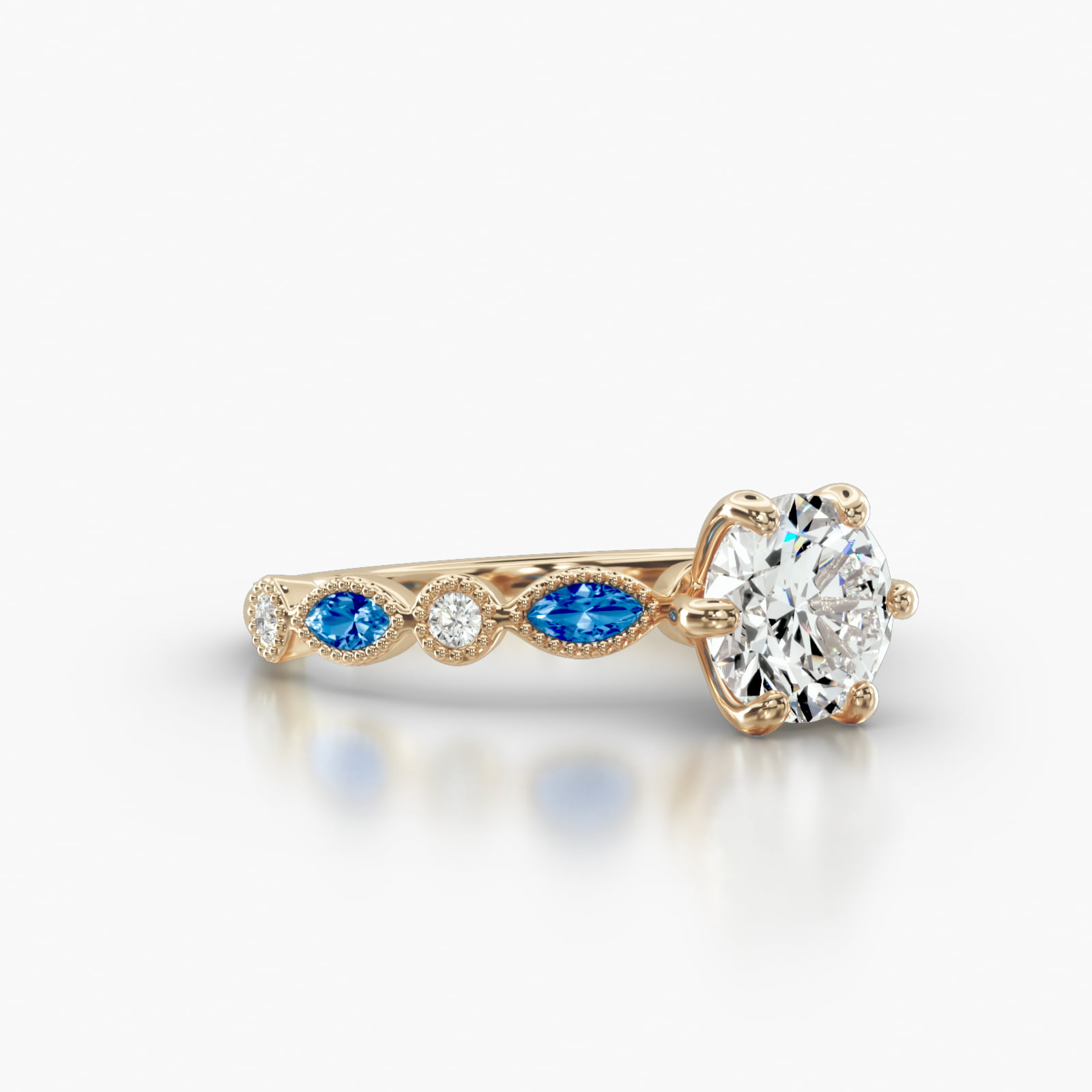 Round Diamond & Sapphire Marquise Shape Engagement Ring Embellished With a Six Prong Signature Head