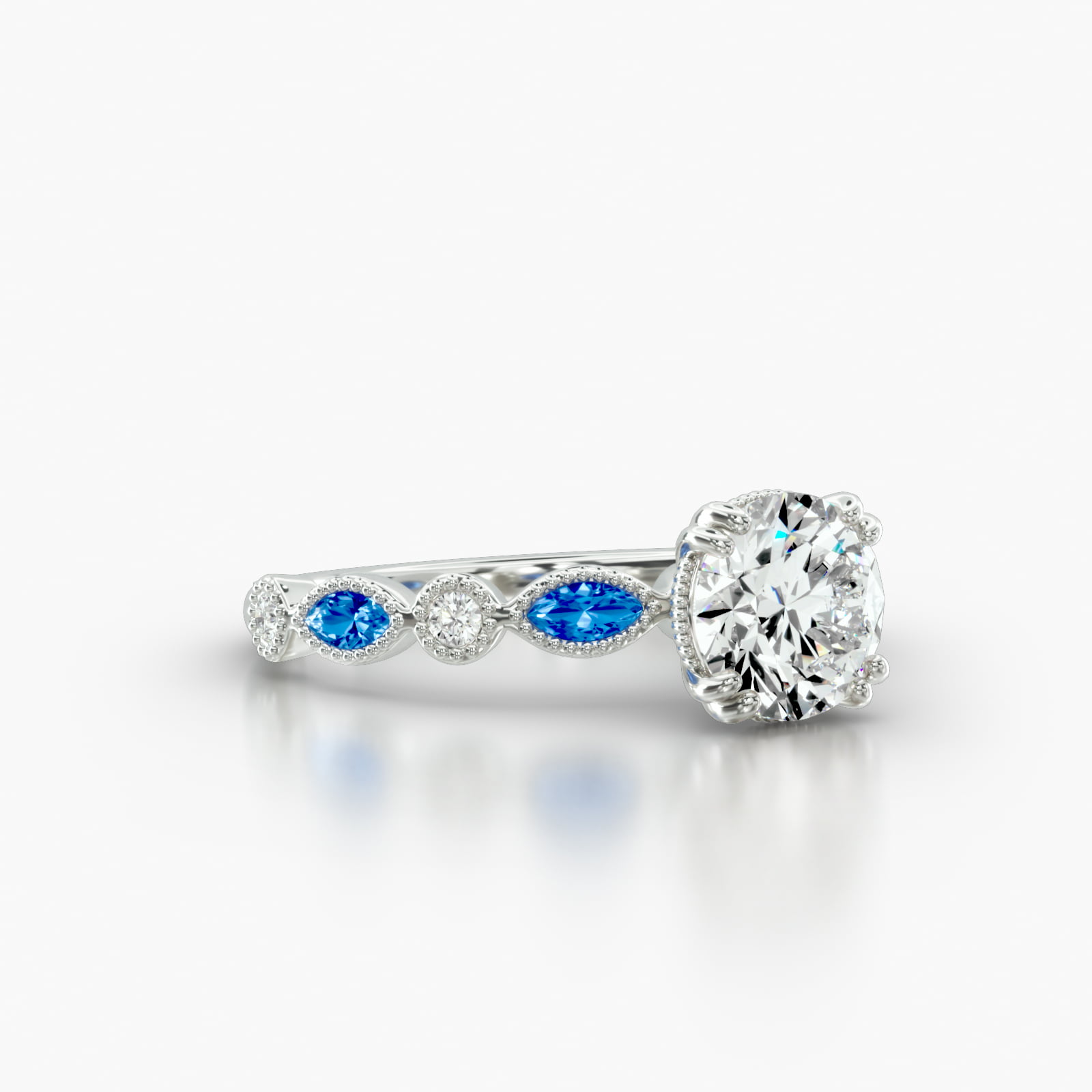 Round Diamond & Sapphire Marquise Shape Engagement Ring Embellished With a Vintage Basket Head
