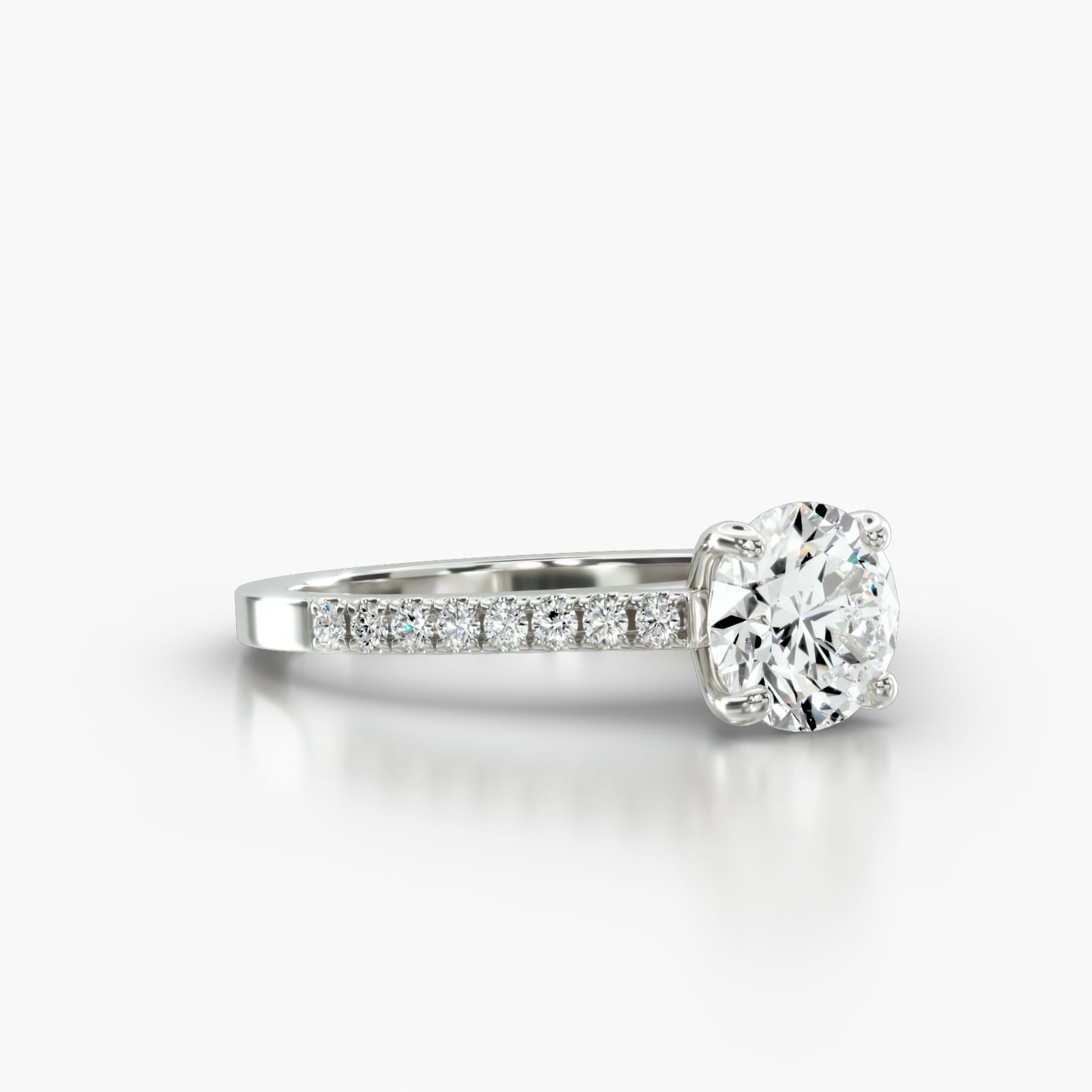 Cathedral Petite Pavé Engagement Ring Embellished With a Four Prong Signature Head With Sapphire Bridge Accent