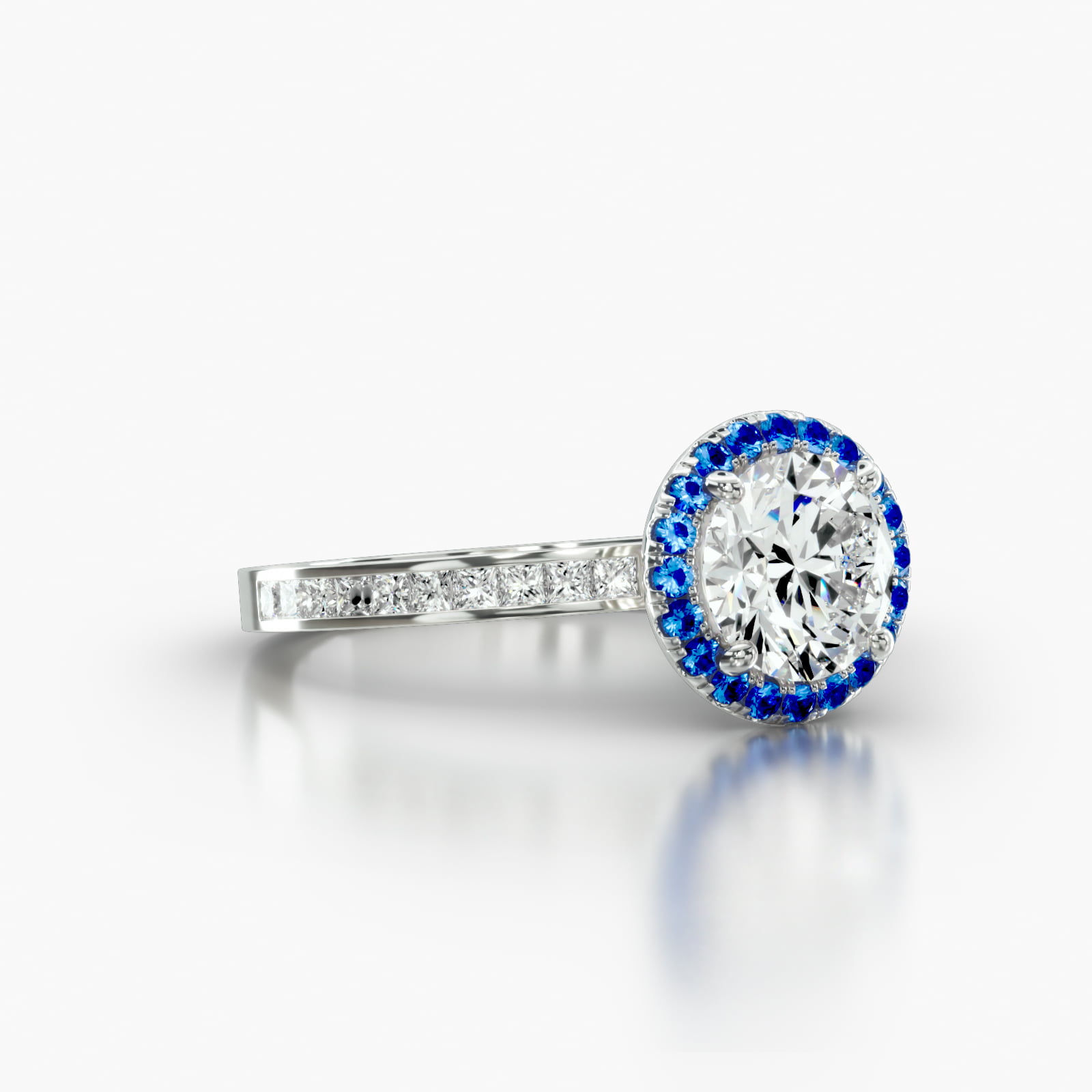 Channel Set Princess Cut Diamond Engagement Ring Embellished With a Single Row Sapphire Pavé Halo Head