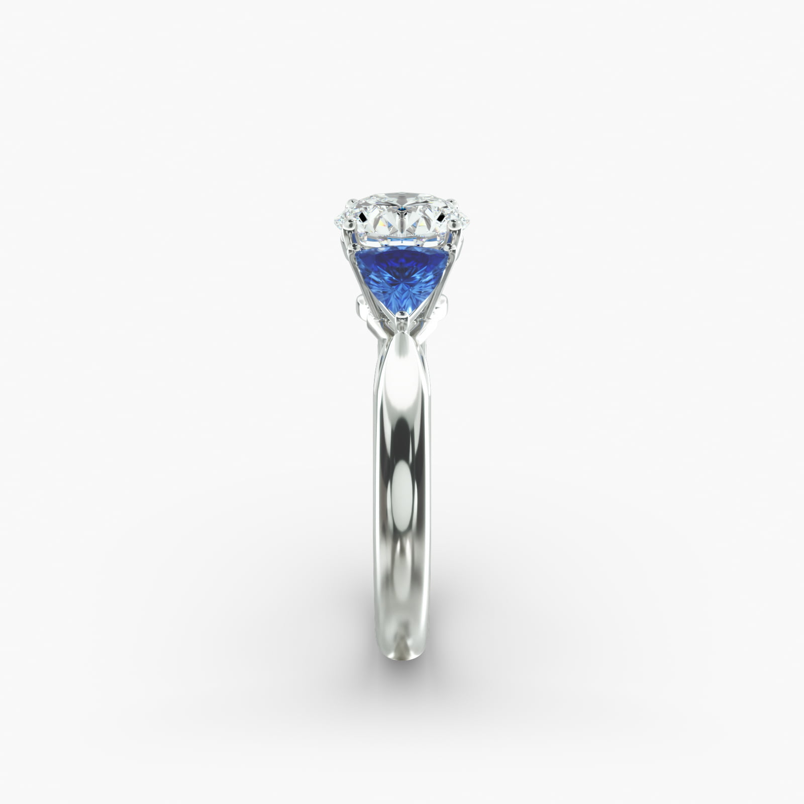 Trillion Cut Blue Sapphire Three Stone Engagement Ring In Platinum
