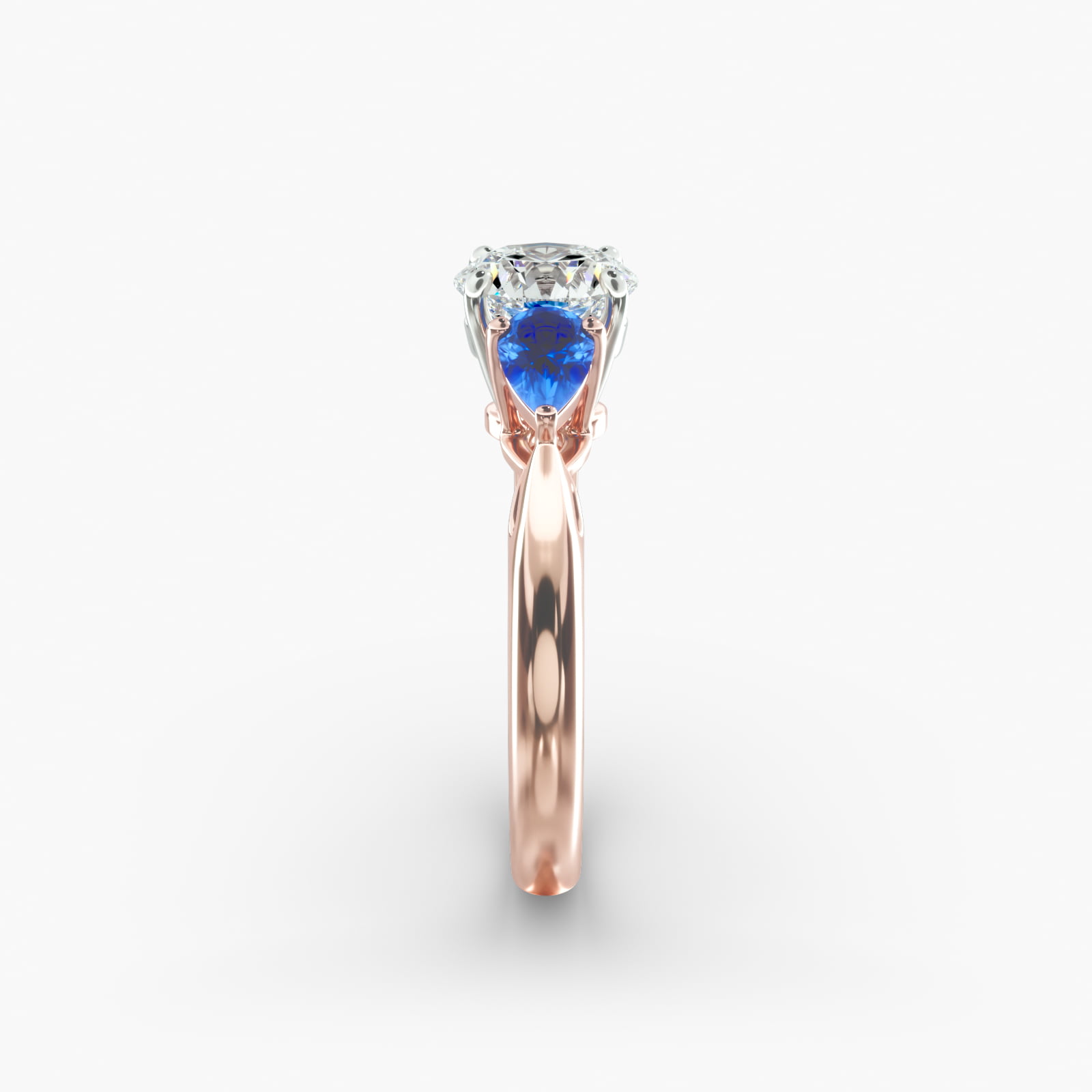 Pear Shaped Blue Sapphire Three Stone Engagement Ring In 14K Rose Gold