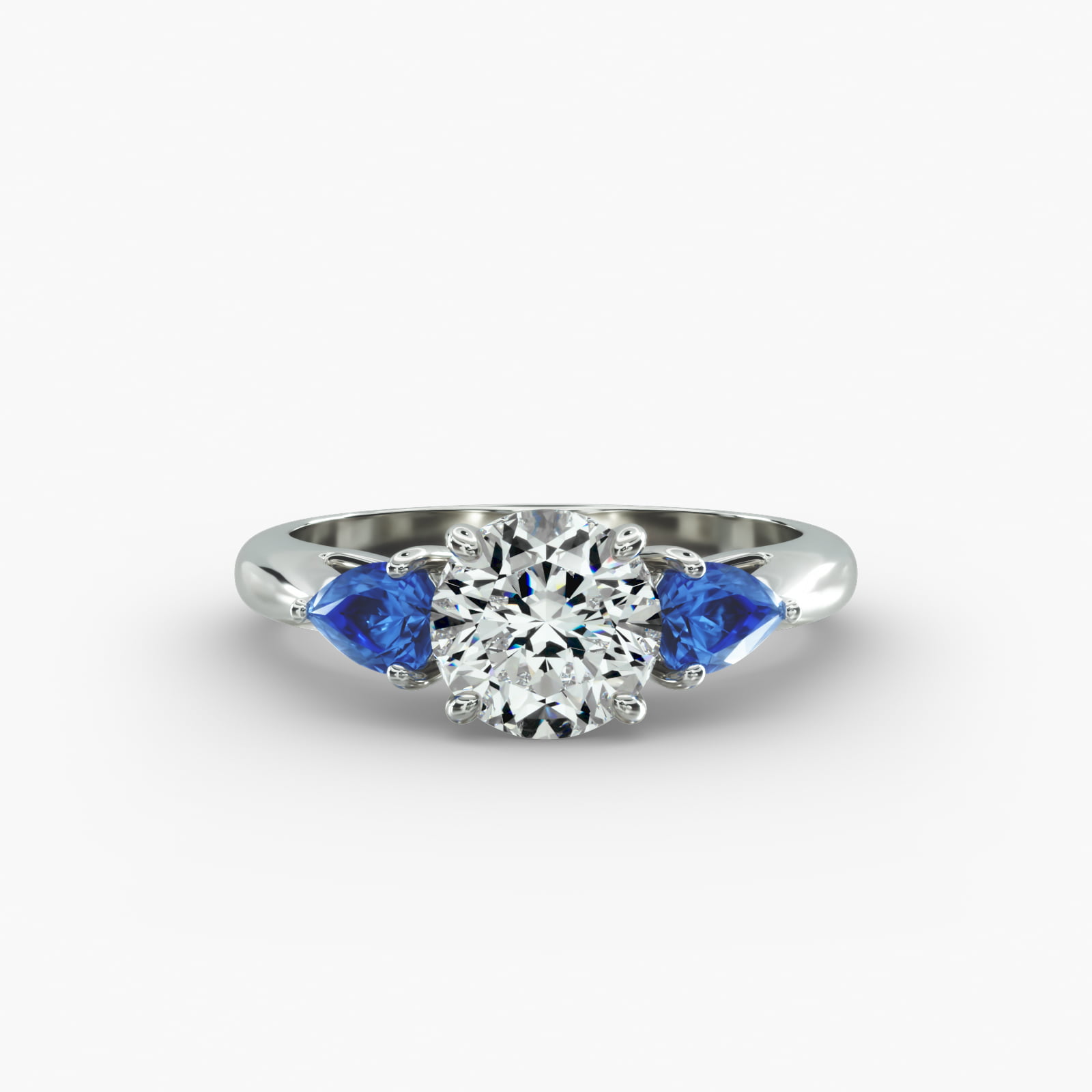 Pear Shaped Blue Sapphire Three Stone Engagement Ring In Platinum