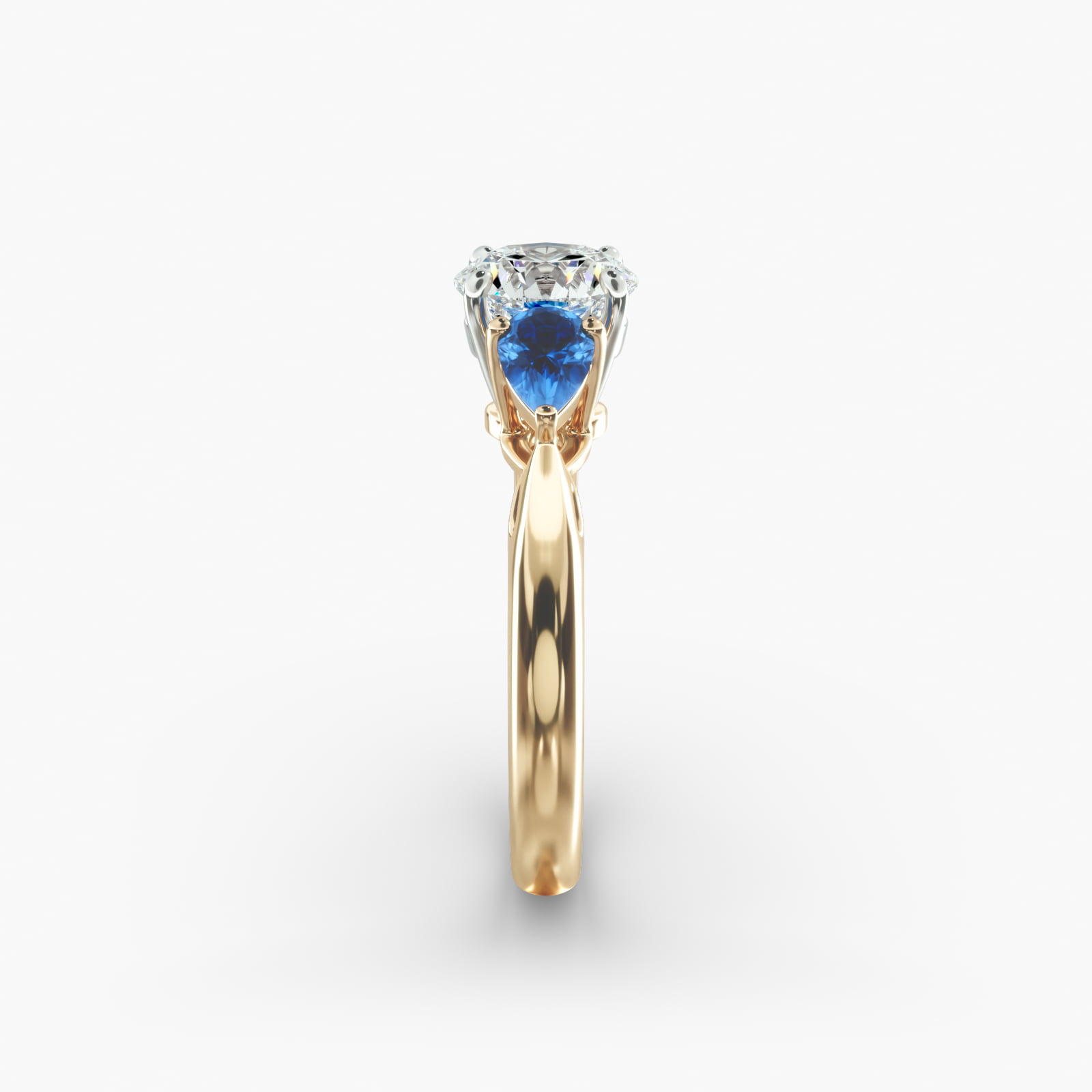 Pear Shaped Blue Sapphire Three Stone Engagement Ring In 18K Yellow Gold