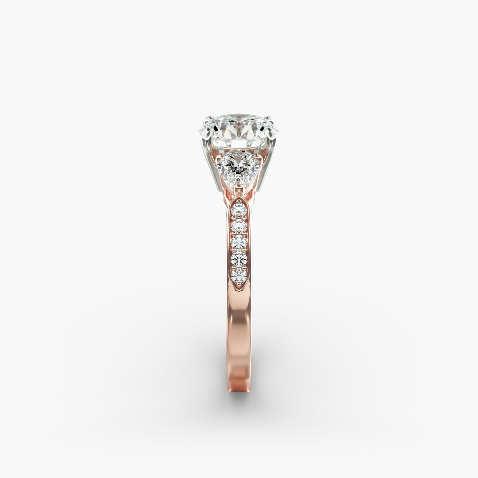 Pear Shaped Diamond Three Stone Engagement Ring With Pavé Set Diamonds In 14K Rose Gold