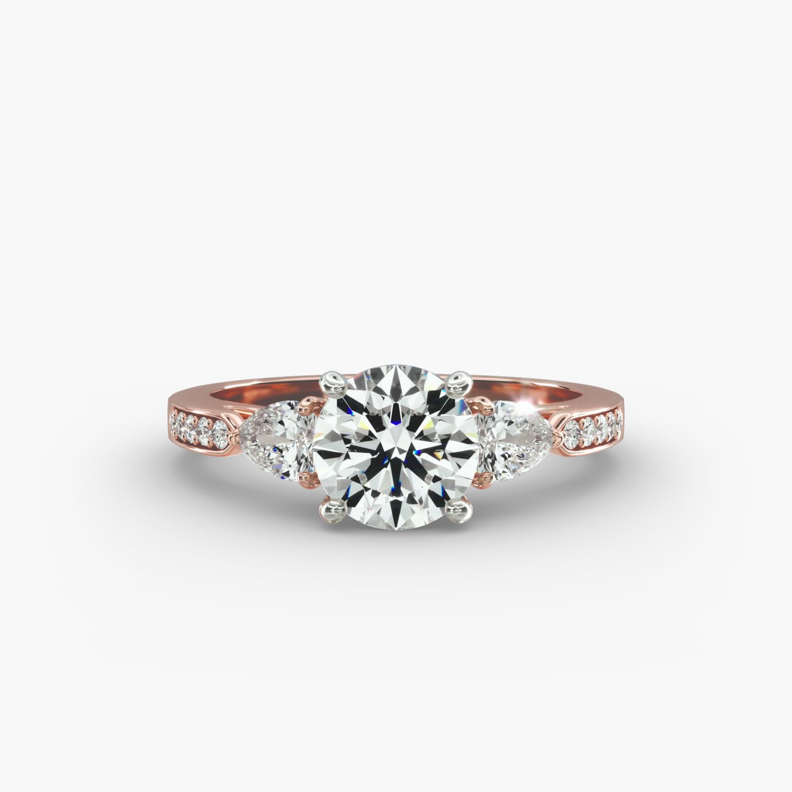 Pear Shaped Diamond Three Stone Engagement Ring With Pavé Set Diamonds In 14K Rose Gold