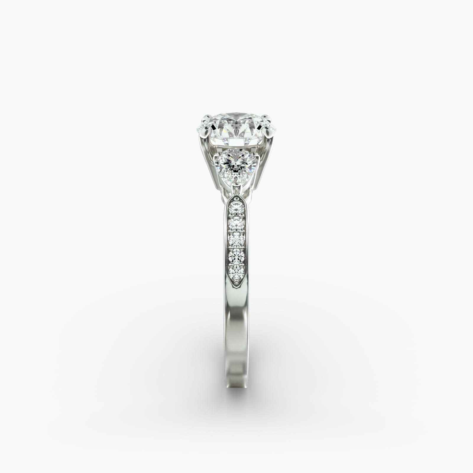 Pear Shaped Diamond Three Stone Engagement Ring With Pavé Set Diamonds In 14K White Gold