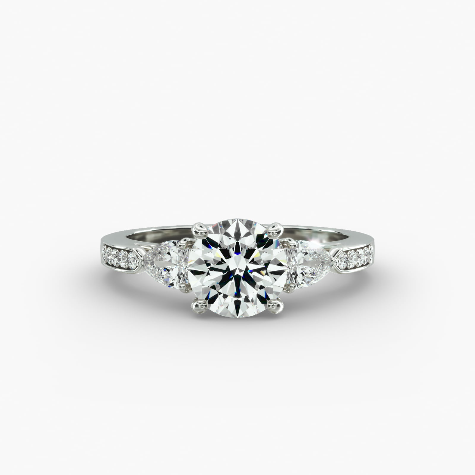 Pear Shaped Diamond Three Stone Engagement Ring With Pavé Set Diamonds In 14K White Gold