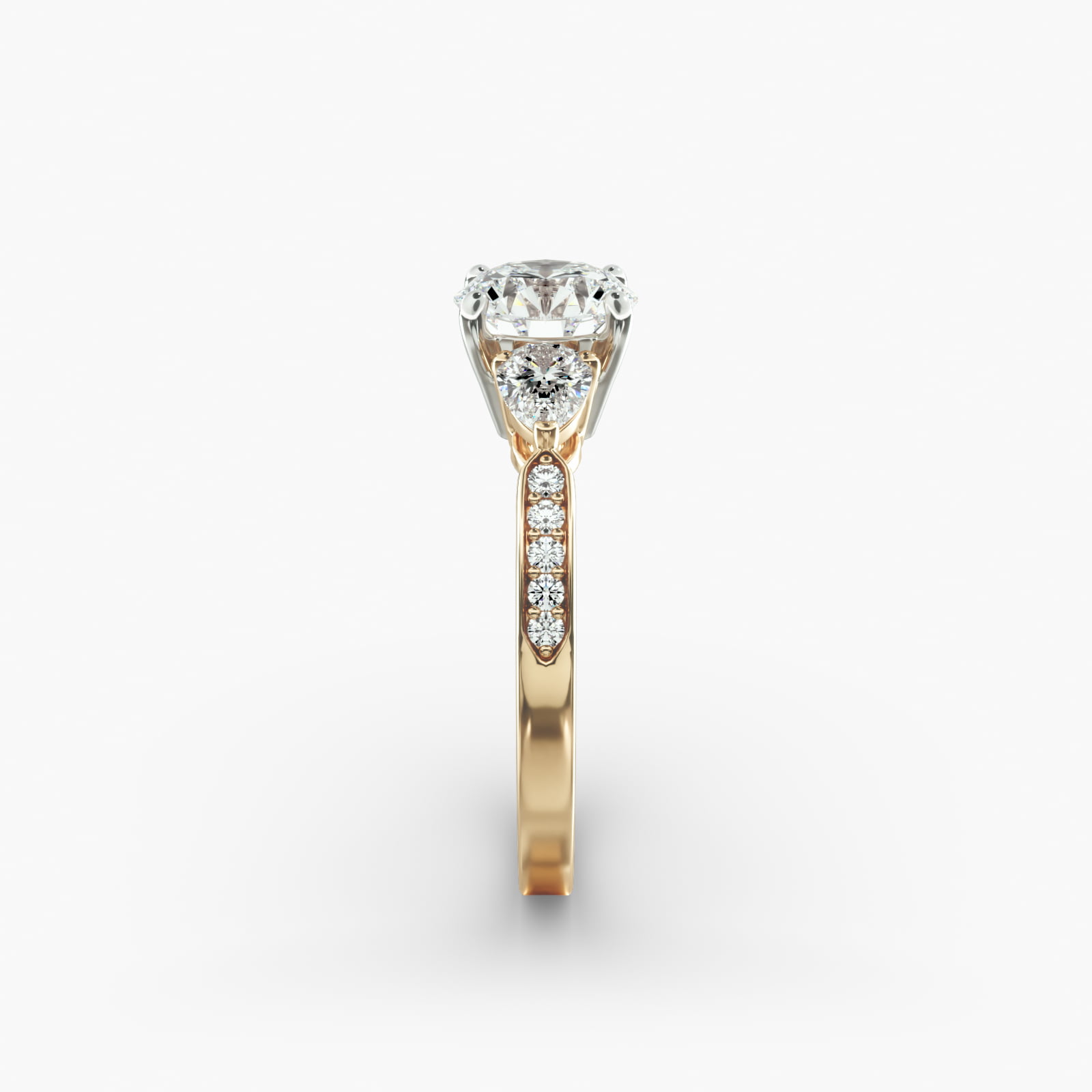 Pear Shaped Diamond Three Stone Engagement Ring With Pavé Set Diamonds In 18K Yellow Gold