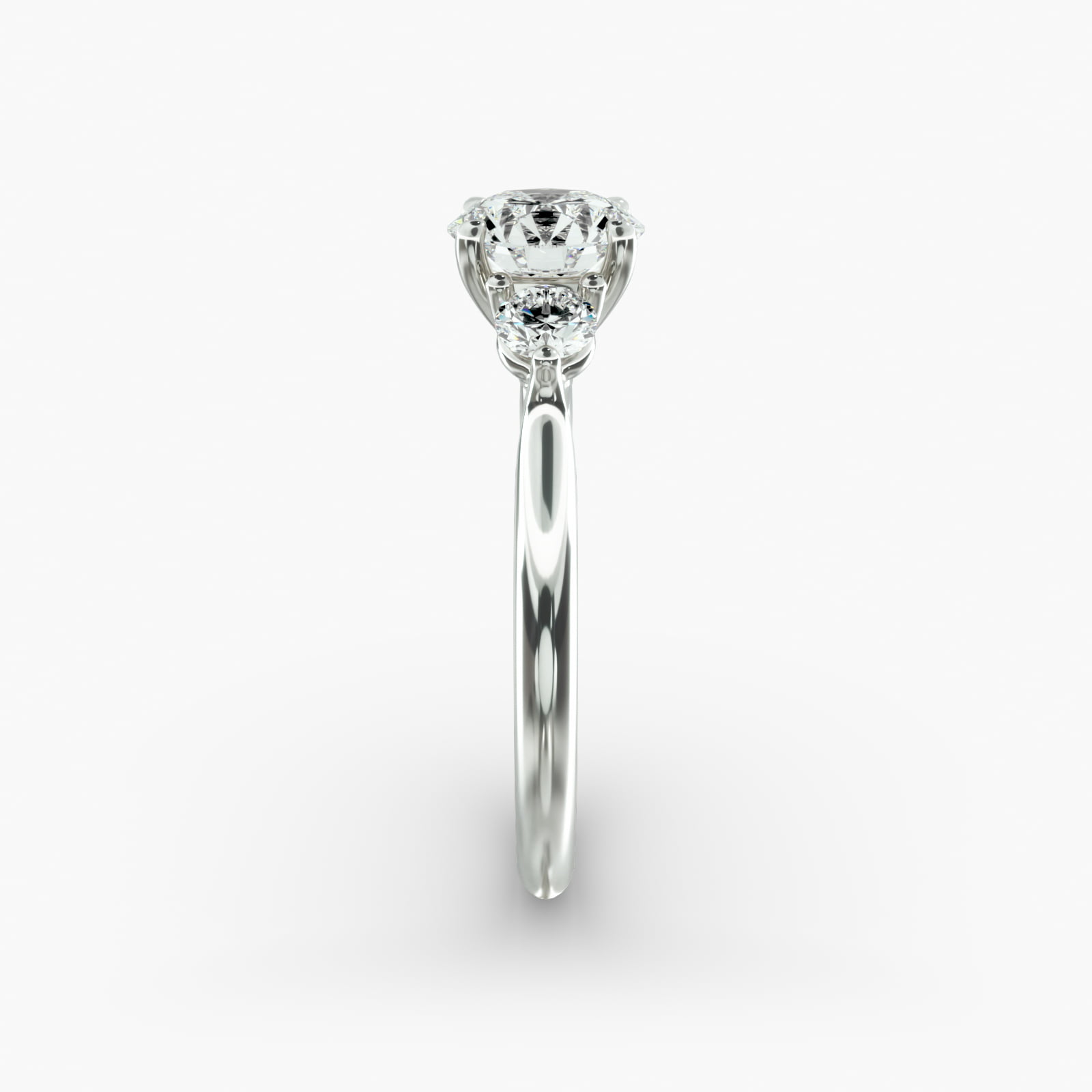 Classic Round Diamond Three Stone Engagement Ring In Platinum