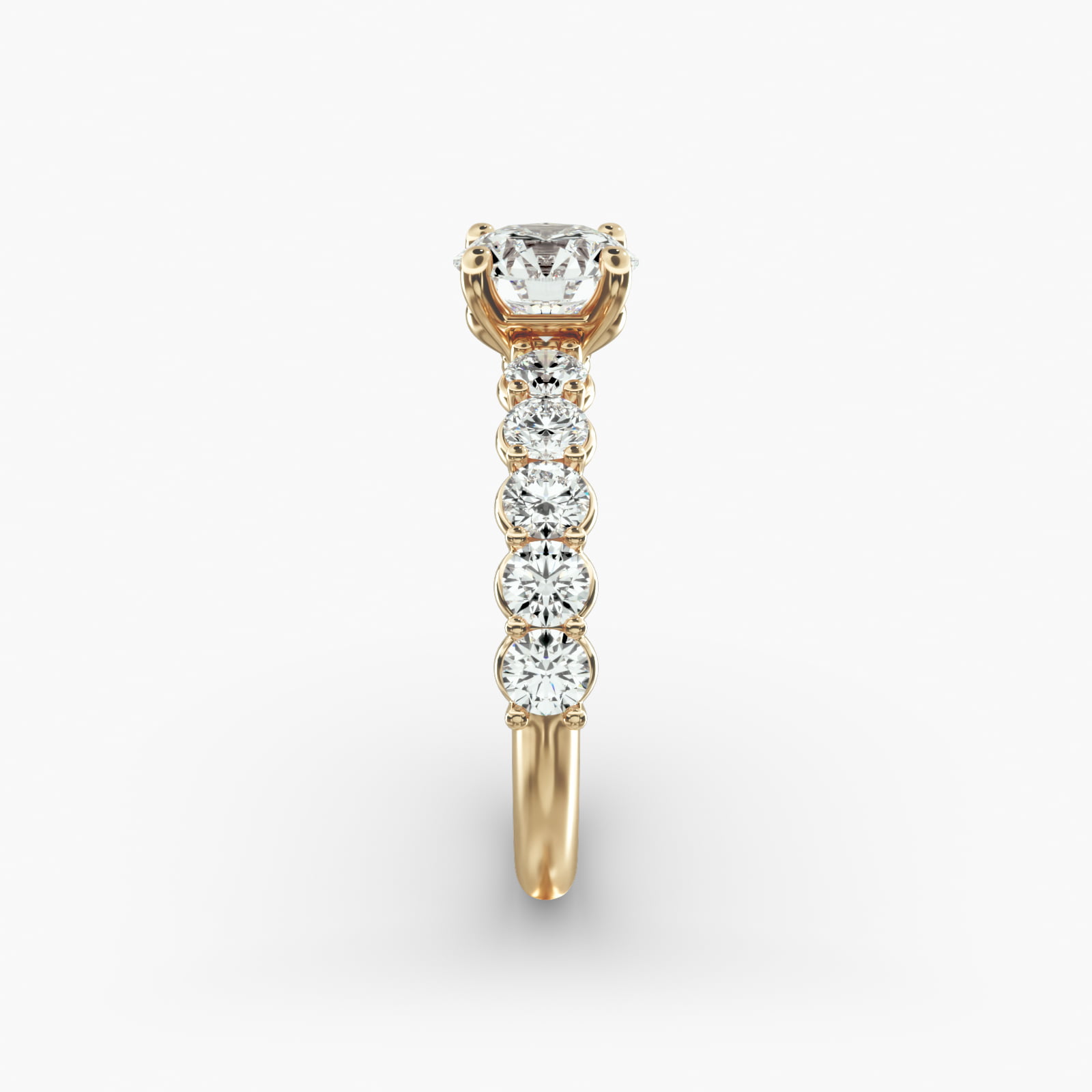 Prong Set Side Stone Diamond Engagement Ring In 14K Yellow Gold