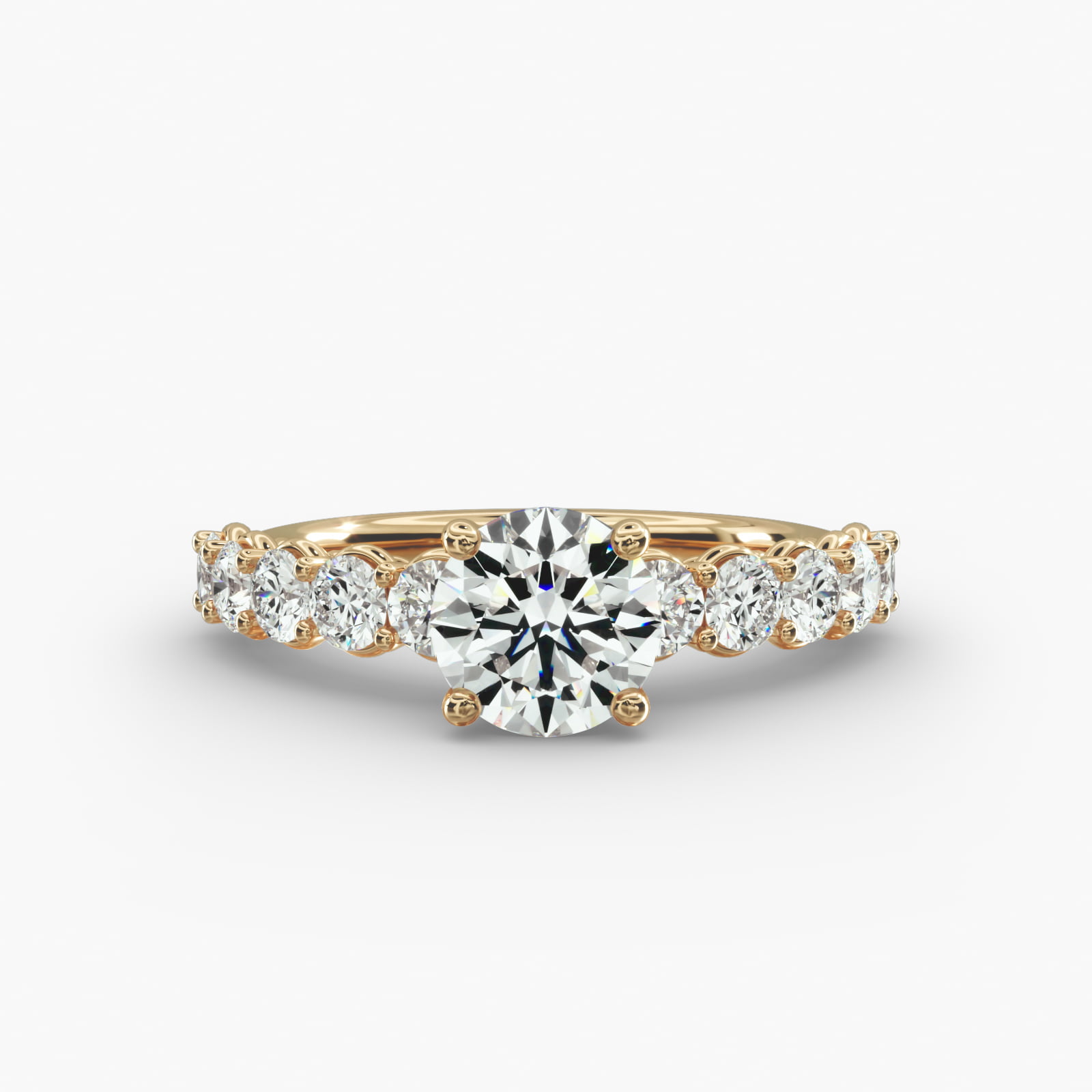 Prong Set Side Stone Diamond Engagement Ring In 14K Yellow Gold