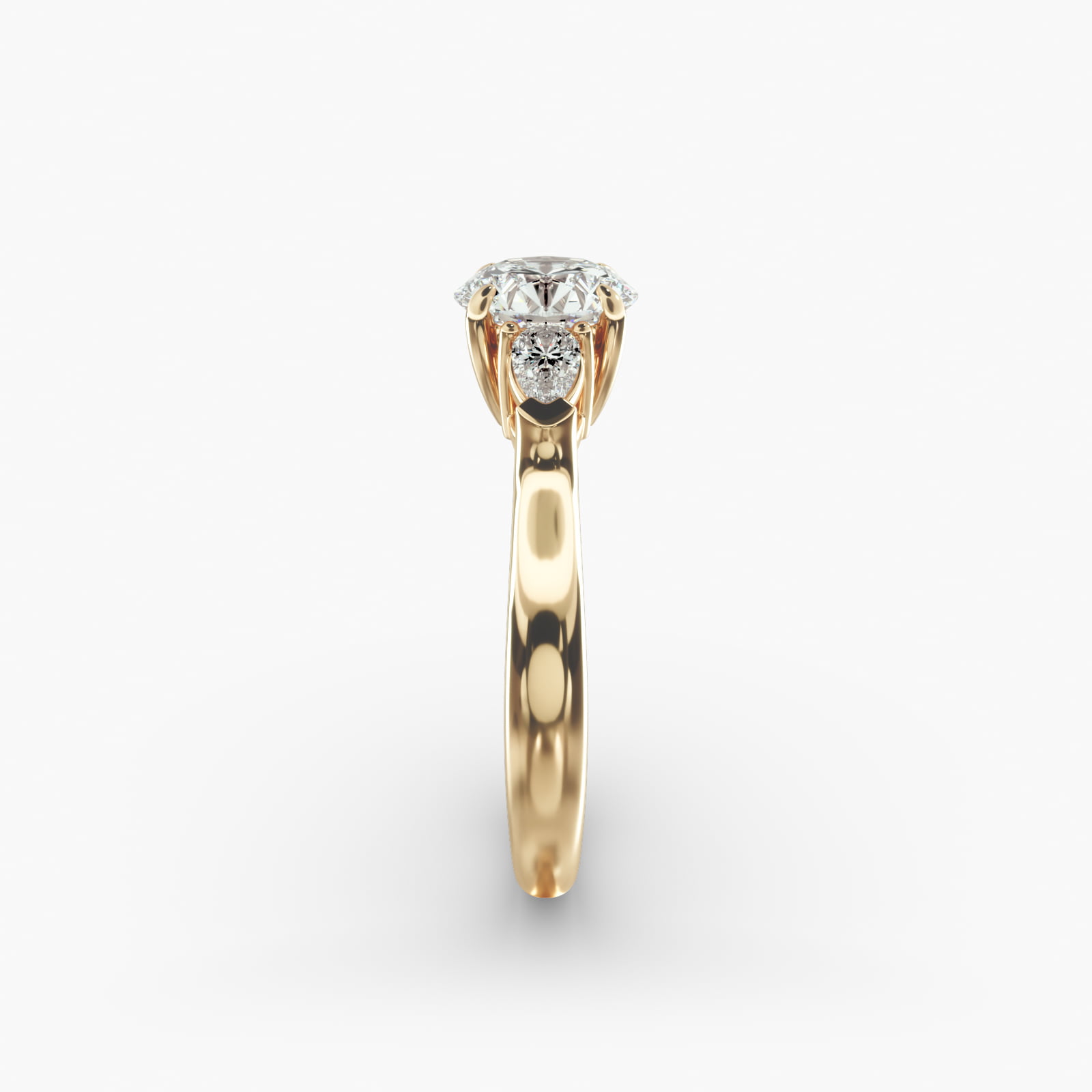 Pear Shaped Diamond Three Stone Engagement Ring In 18K Yellow Gold