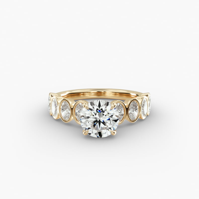 Bezel Set Oval Cut Side Stone Diamond Engagement Ring In 14K Yellow Gold